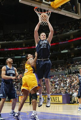 LOS ANGELES - JANUARY 17:  Curtis Borchardt #22 of the Utah Jazz rebounds near Brian Grant #55 of the Los Angeles Lakers during the game on January 17, 2005 at Staples Center in Los Angeles, California. The Jazz won 102-94. NOTE TO USER: User expressly ac
