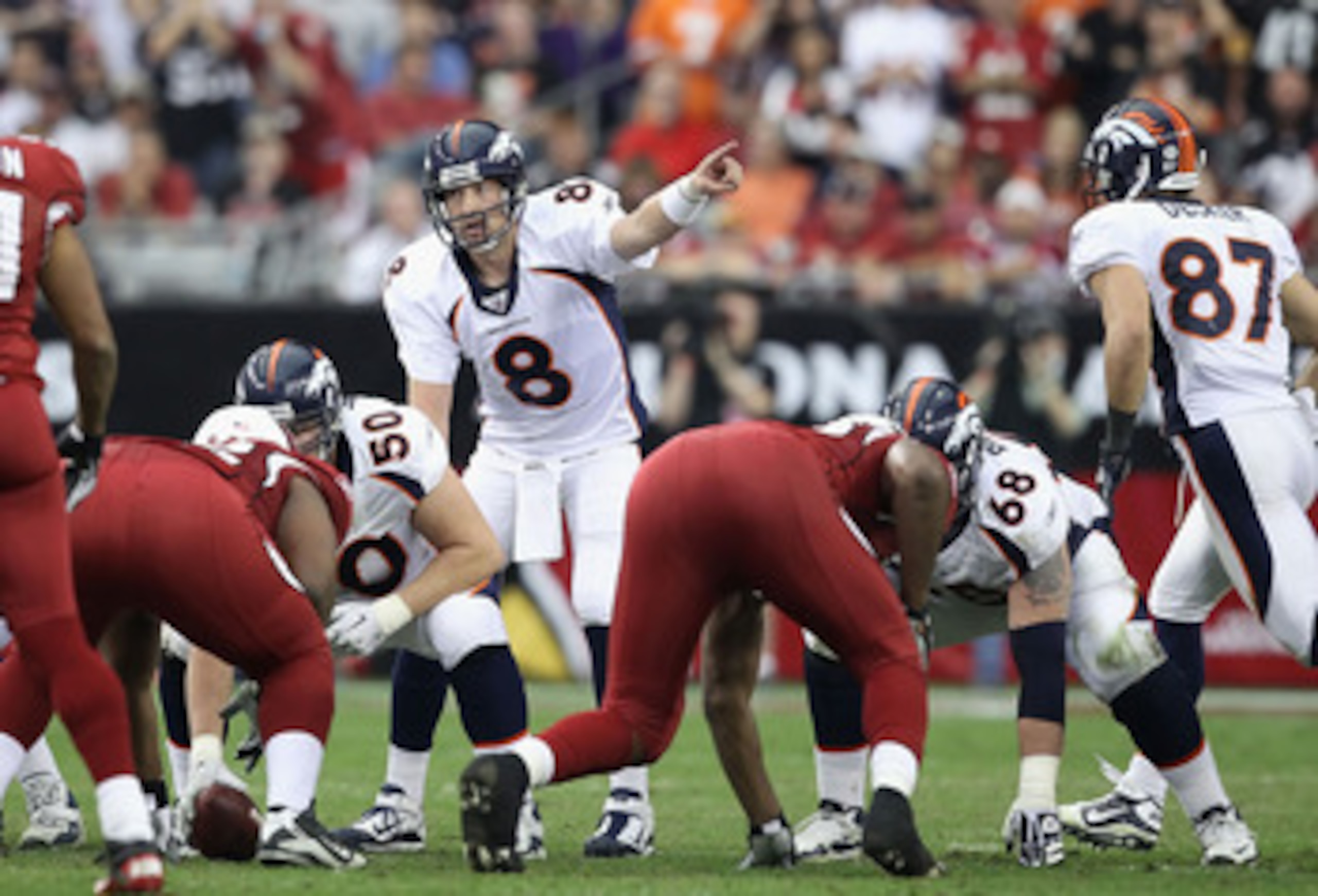 GLENDALE, AZ - DECEMBER 12:  Quarterback Kyle Orton #8 of the Denver Broncos prepares to snap the ball during the NFL game against the Arizona Cardinals at the University of Phoenix Stadium on December 12, 2010 in Glendale, Arizona.  The Cardinals defeate
