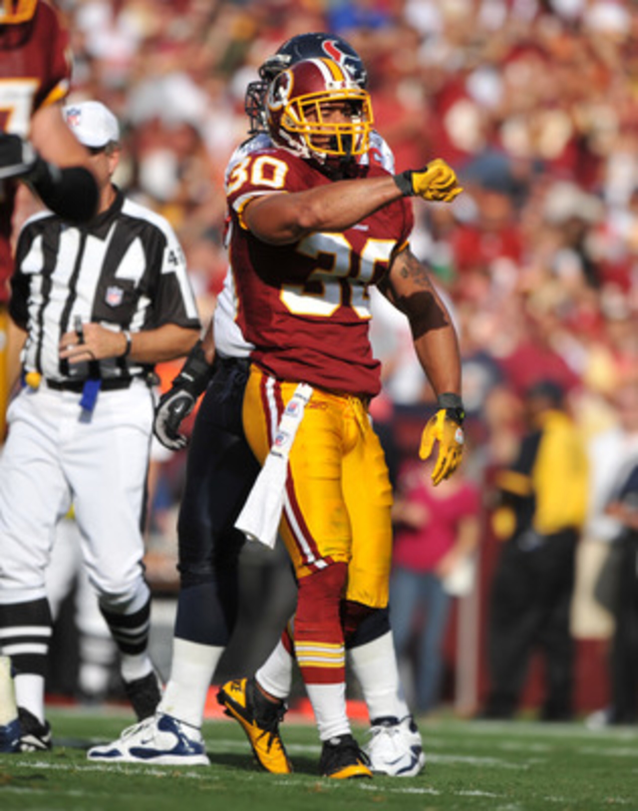 LANDOVER, MD - SEPTEMBER 19:  LaRon Landry #30 of the Washington Redskins celebrates a play against the Houston Texans at FedExField on September 19, 2010 in Landover, Maryland. The Texans defeated the Redskins in overtime 30-27. (Photo by Larry French/Ge