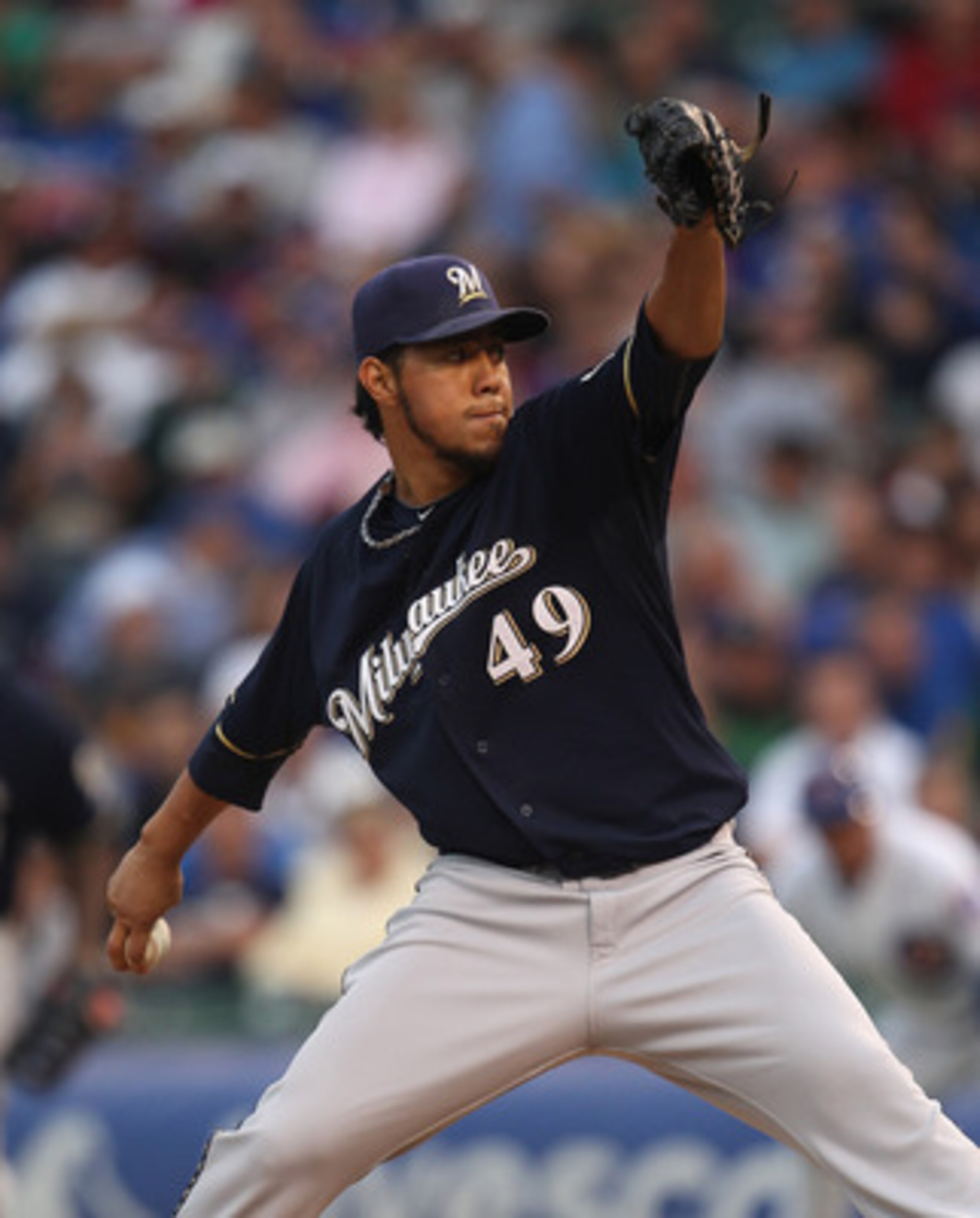 CHICAGO, IL - JUNE 14:  Starting pitcher Yovani Gallardo #49 of the Milwaukee Brewers delivers the ball against the Chicago Cubs at Wrigley Field on June 14, 2011 in Chicago, Illinois.  (Photo by Jonathan Daniel/Getty Images)