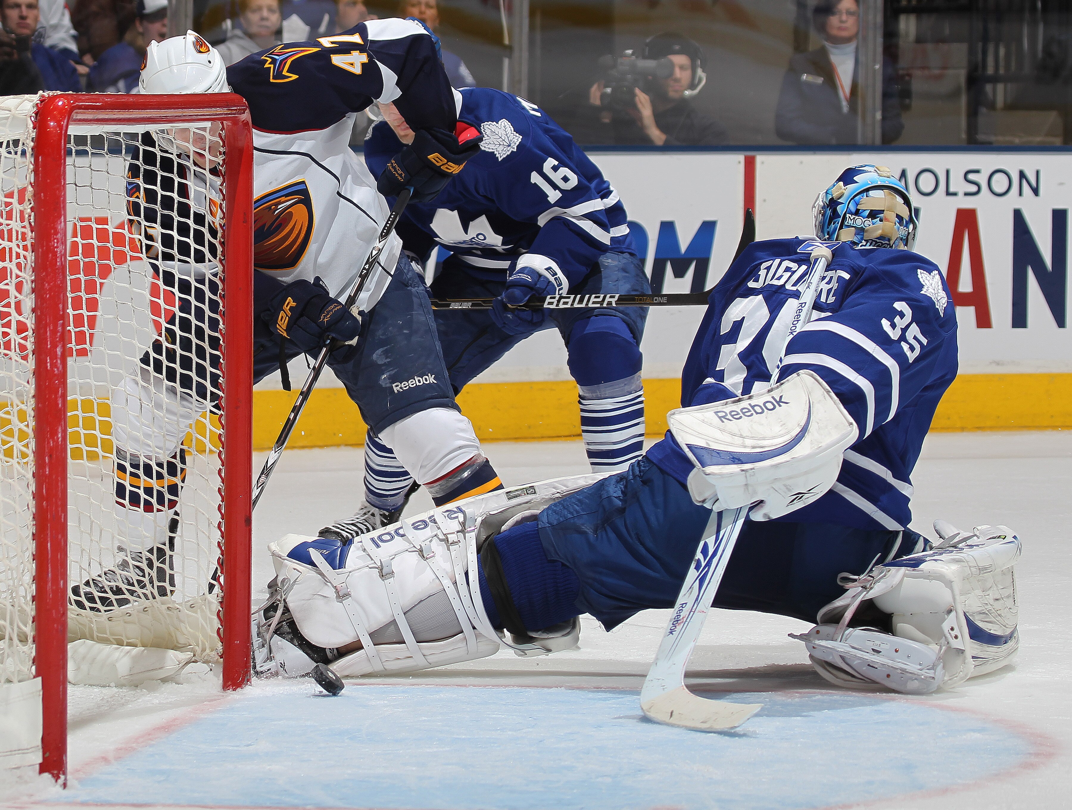 TORONTO, CANADA - FEBRUARY 7:  Rich Peverley #47 of the Atlanta Thrashers gets the puck past JS Giguere #35 of the Toronto Maple Leafs to an open teammate Andrew Ladd #16 in a game on February 7, 2011 at the Air Canada Centre in Toronto, Canada. The Leafs