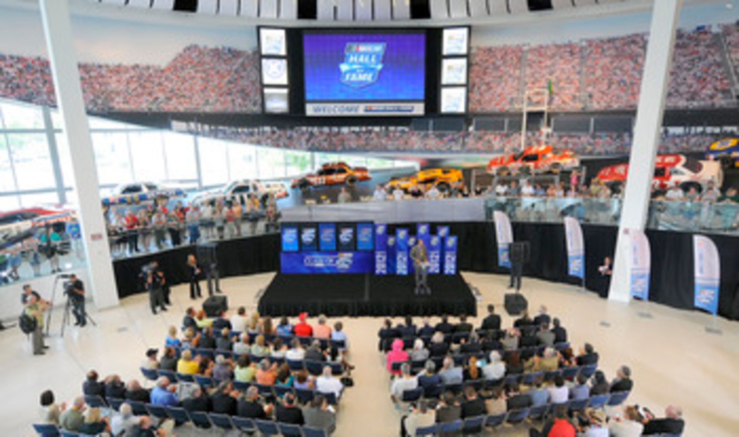 CHARLOTTE, NC - JUNE 14:  2012 Hall of Fame Inductees Darrell Waltrip (R) and Dale Inman celebrate after hearing their names called for induction during the NASCAR Hall of Fame Voting Day at NASCAR Hall of Fame on June 14, 2011 in Charlotte, North Carolin