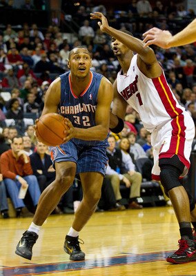 CHARLOTTE, NC - FEBRUARY 04:  Boris Diaw #32 of the Charlotte Bobcats drives the baseline past Chris Bosh #1 of the Miami Heat at the Time Warner Cable Arena on February 4, 2011 in Charlotte, North Carolina.  The Heat defeated the Bobcats 109-97.  NOTE TO