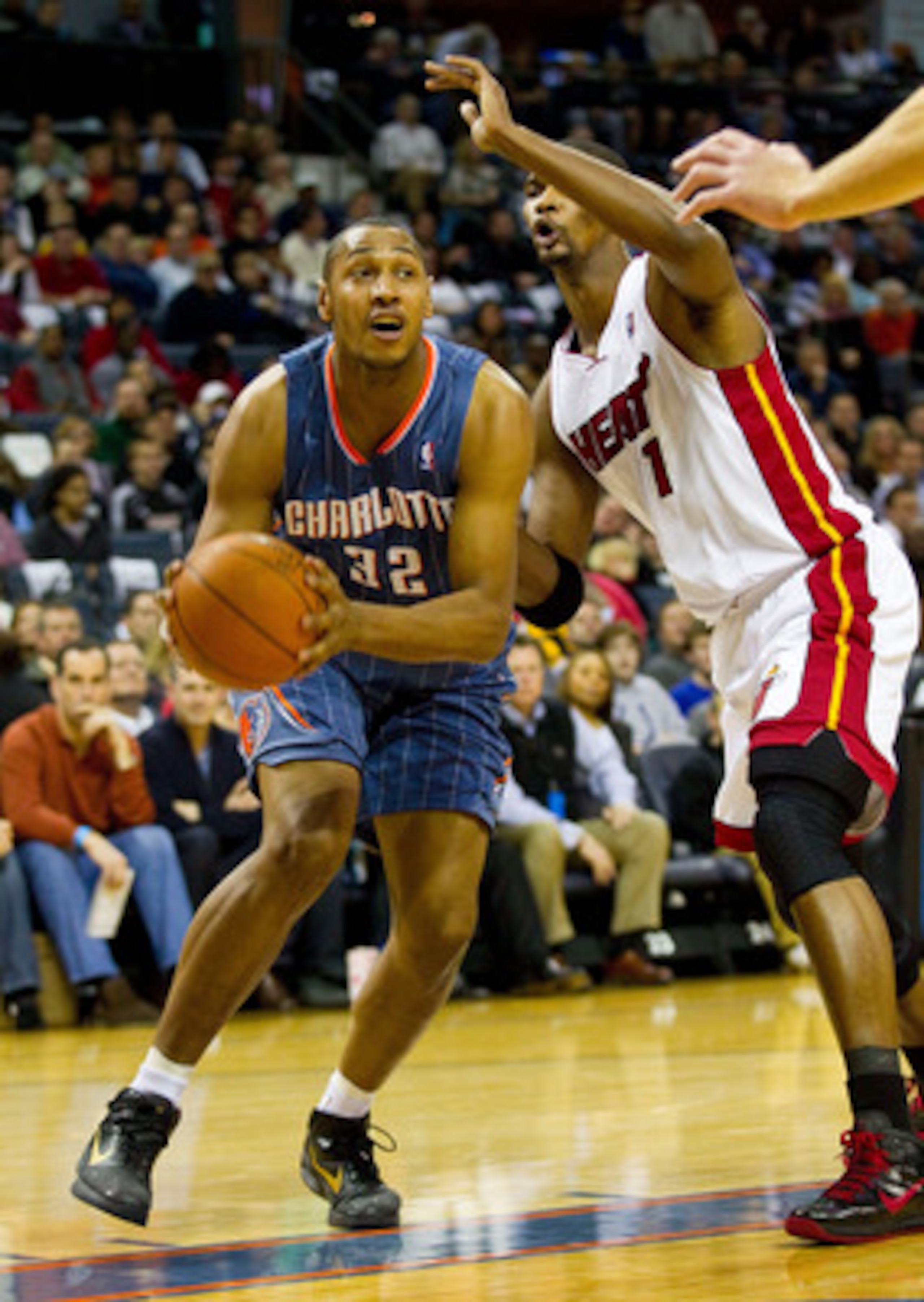 CHARLOTTE, NC - FEBRUARY 04:  Boris Diaw #32 of the Charlotte Bobcats drives the baseline past Chris Bosh #1 of the Miami Heat at the Time Warner Cable Arena on February 4, 2011 in Charlotte, North Carolina.  The Heat defeated the Bobcats 109-97.  NOTE TO