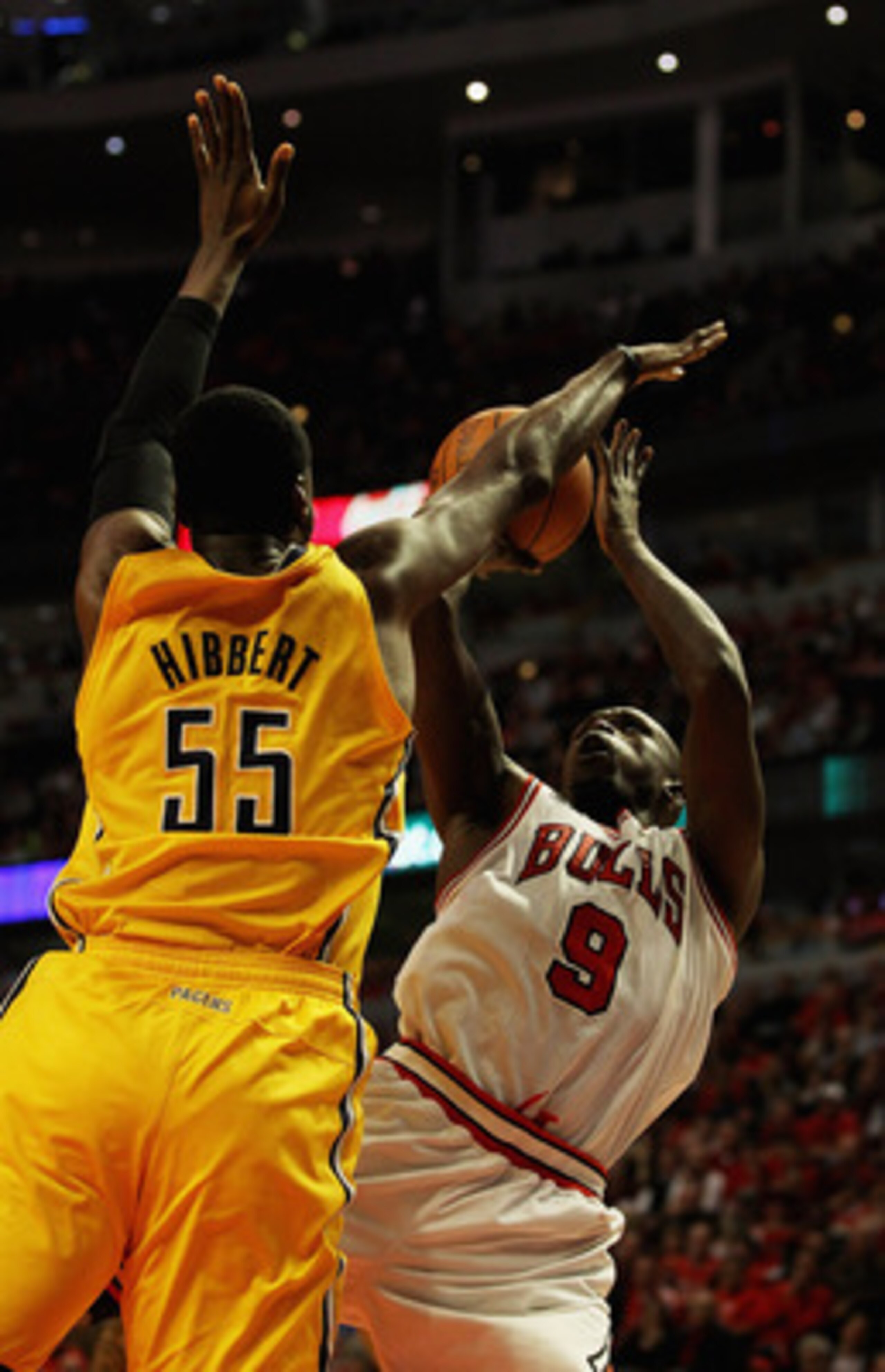 CHICAGO, IL - APRIL 26: Loul Deng #9 of the Chicago Bulls puts up a shot against Roy Hibbert #55 of the Indiana Pacers in Game Five of the Eastern Conference Quarterfinals in the 2011 NBA Playoffs at the United Center on April 26, 2011 in Chicago, Illinoi