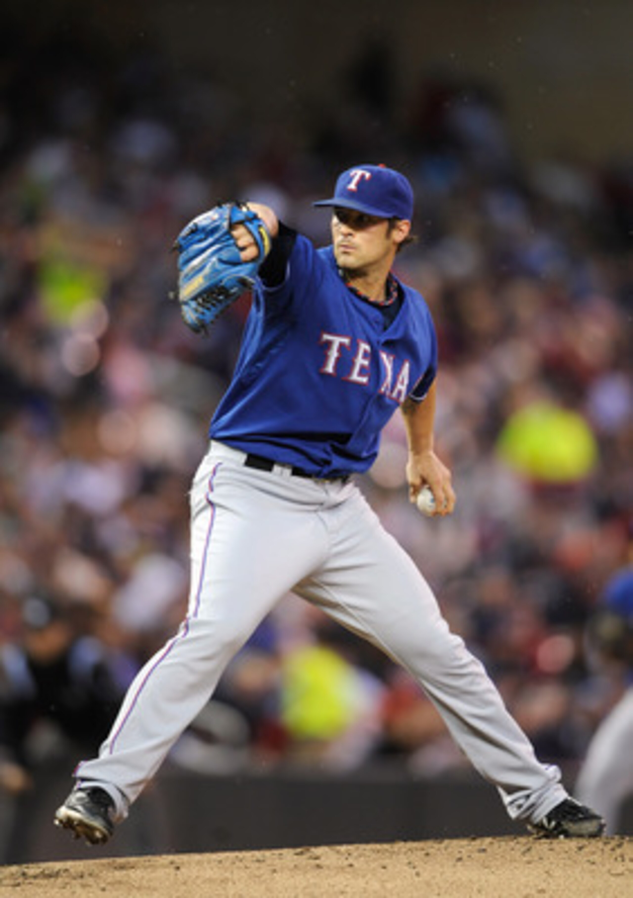 MINNEAPOLIS, MN - JUNE 10: C.J. Wilson #36 of the Texas Rangers pitches against the Minnesota Twins during the first inning of their game on June 10, 2011 at Target Field in Minneapolis, Minnesota. (Photo by Hannah Foslien/Getty Images)