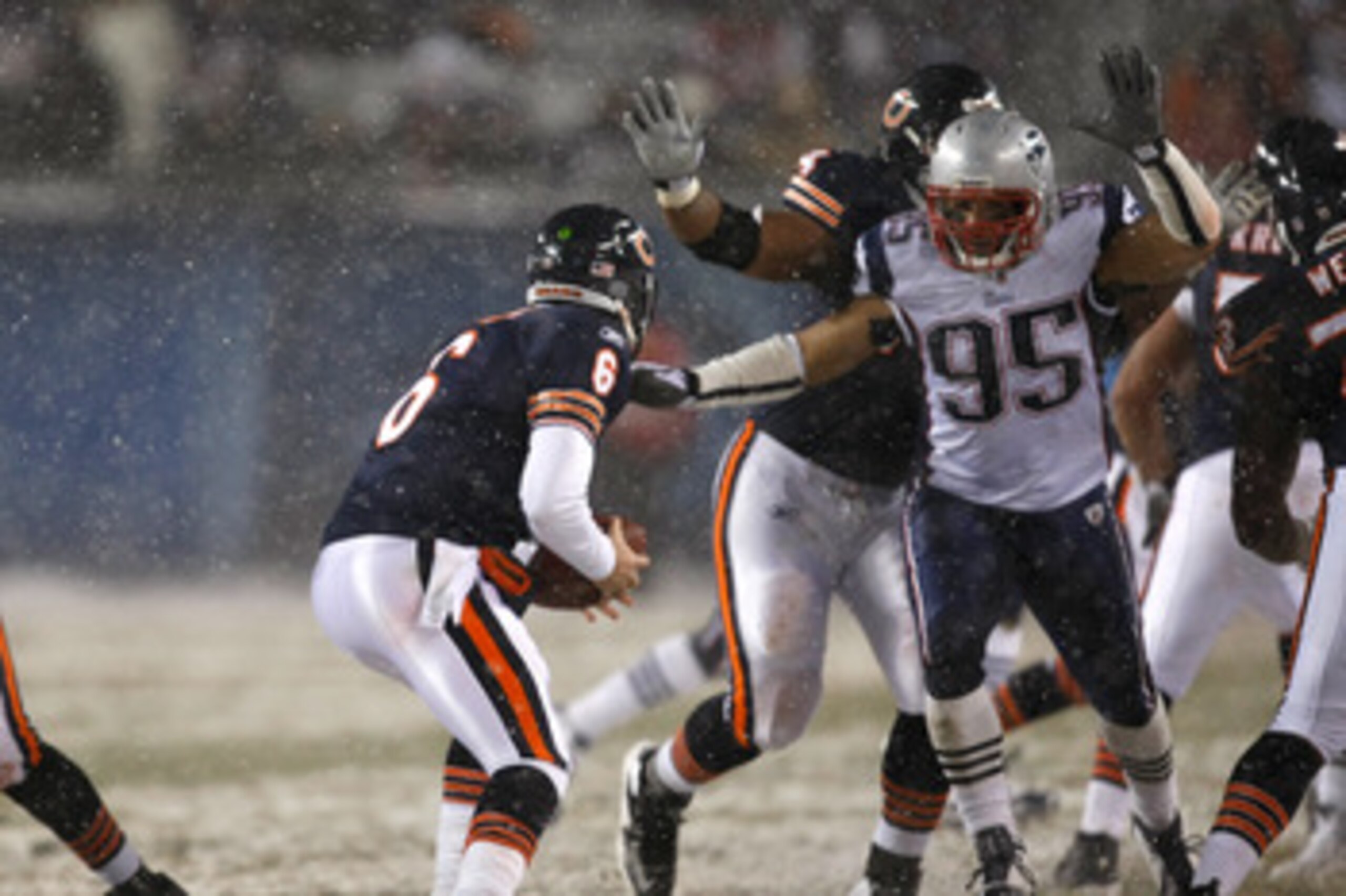 CHICAGO, IL - DECEMBER 12: Jay Cutler #6 of the Chicago Bears runs under pressure by Tully Banta Cain #95 of the New England Patriots at Soldier Field on December 12, 2010 in Chicago, Illinois. The Patriots defeated the Bears 36-7. (Photo by Scott Boehm/G