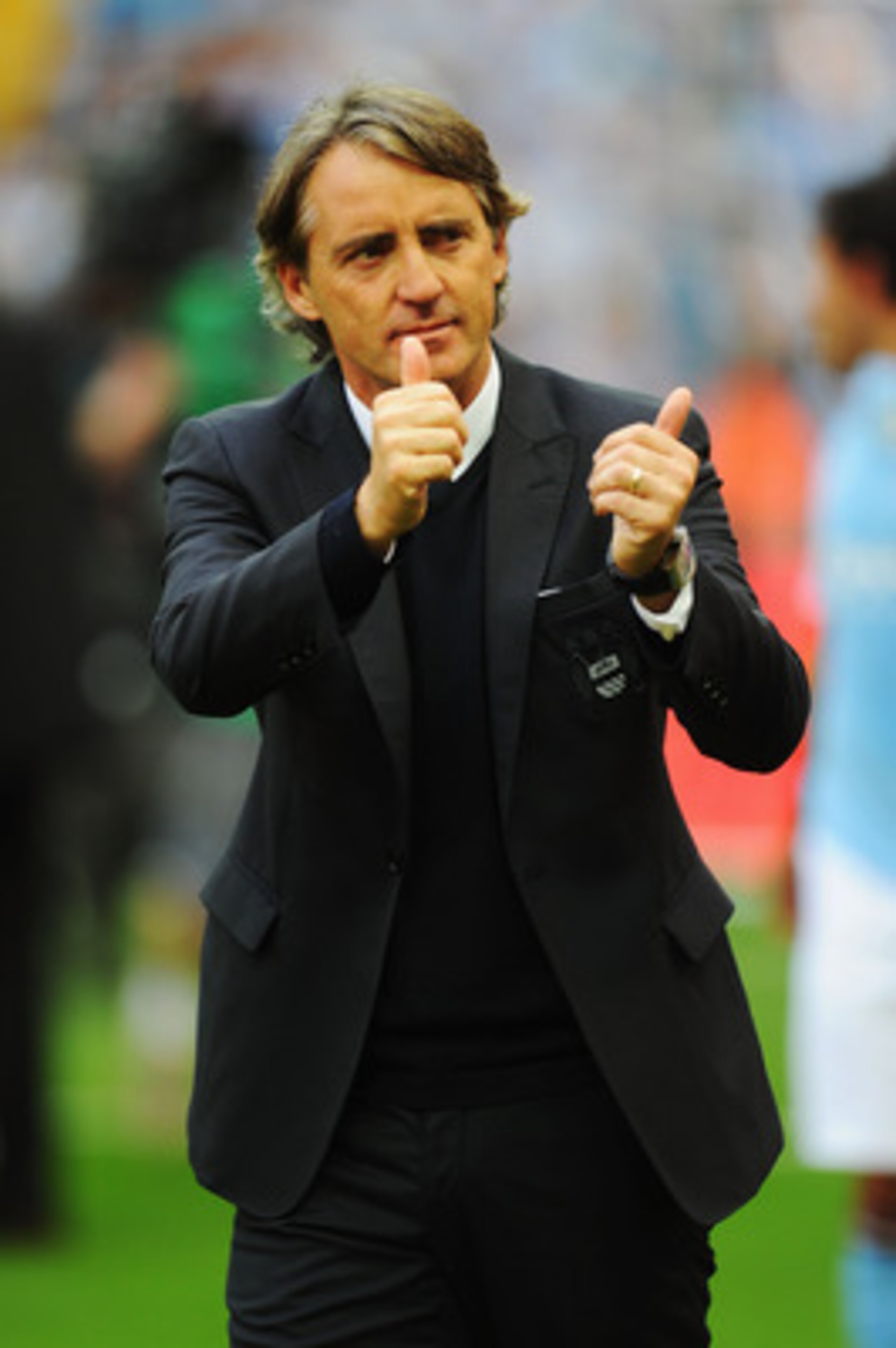 LONDON, ENGLAND - MAY 14:  Roberto Mancini reacts after his Manchester City team wins the FA Cup sponsored by E.ON Final match between Manchester City and Stoke City at Wembley Stadium on May 14, 2011 in London, England.  (Photo by Mike Hewitt/Getty Image