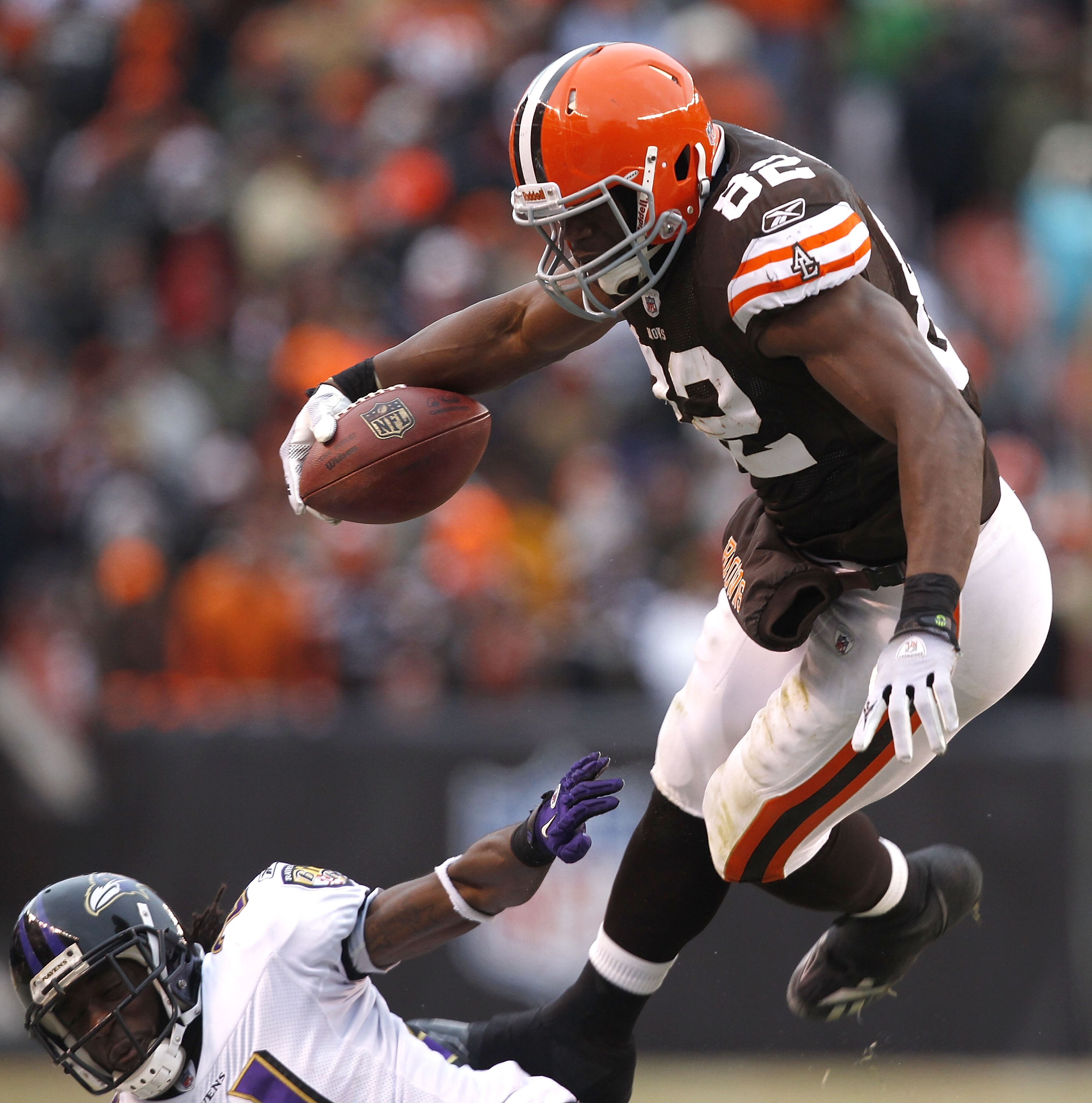 CLEVELAND - DECEMBER 26:  Cornerback Lardarius Webb #21 of the Baltimore Ravens hits tight end Benjamin Watson #82 of the Cleveland Browns at Cleveland Browns Stadium on December 26, 2010 in Cleveland, Ohio.  (Photo by Matt Sullivan/Getty Images)
