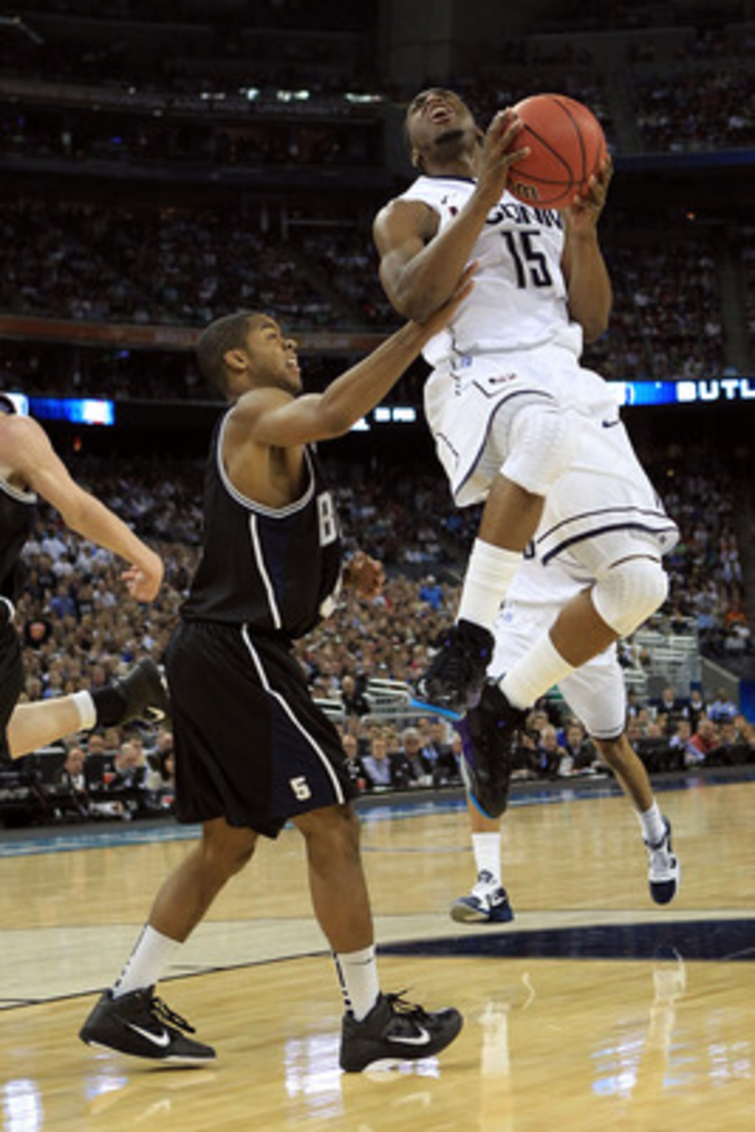 HOUSTON, TX - APRIL 04: Kemba Walker #15 of the Connecticut Huskies goes to the basket against Ronald Nored #5 of the Butler Bulldogs during the National Championship Game of the 2011 NCAA Division I Men's Basketball Tournament at Reliant Stadium on Apri HOUSTON, TX - APRIL 04: Kemba Walker #15 of the Connecticut Huskies goes to the basket against Ronald Nored #5 of the Butler Bulldogs during the National Championship Game of the 2011 NCAA Division I Men's Basketball Tournament at Reliant Stadium on Apri