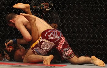 SYDNEY, AUSTRALIA - FEBRUARY 27:  BJ Penn of the USA is pinned down by Jon Fitch of the USA during their welterweight bout part of UFC 127 at Acer Arena on February 27, 2011 in Sydney, Australia.  (Photo by Mark Kolbe/Getty Images)