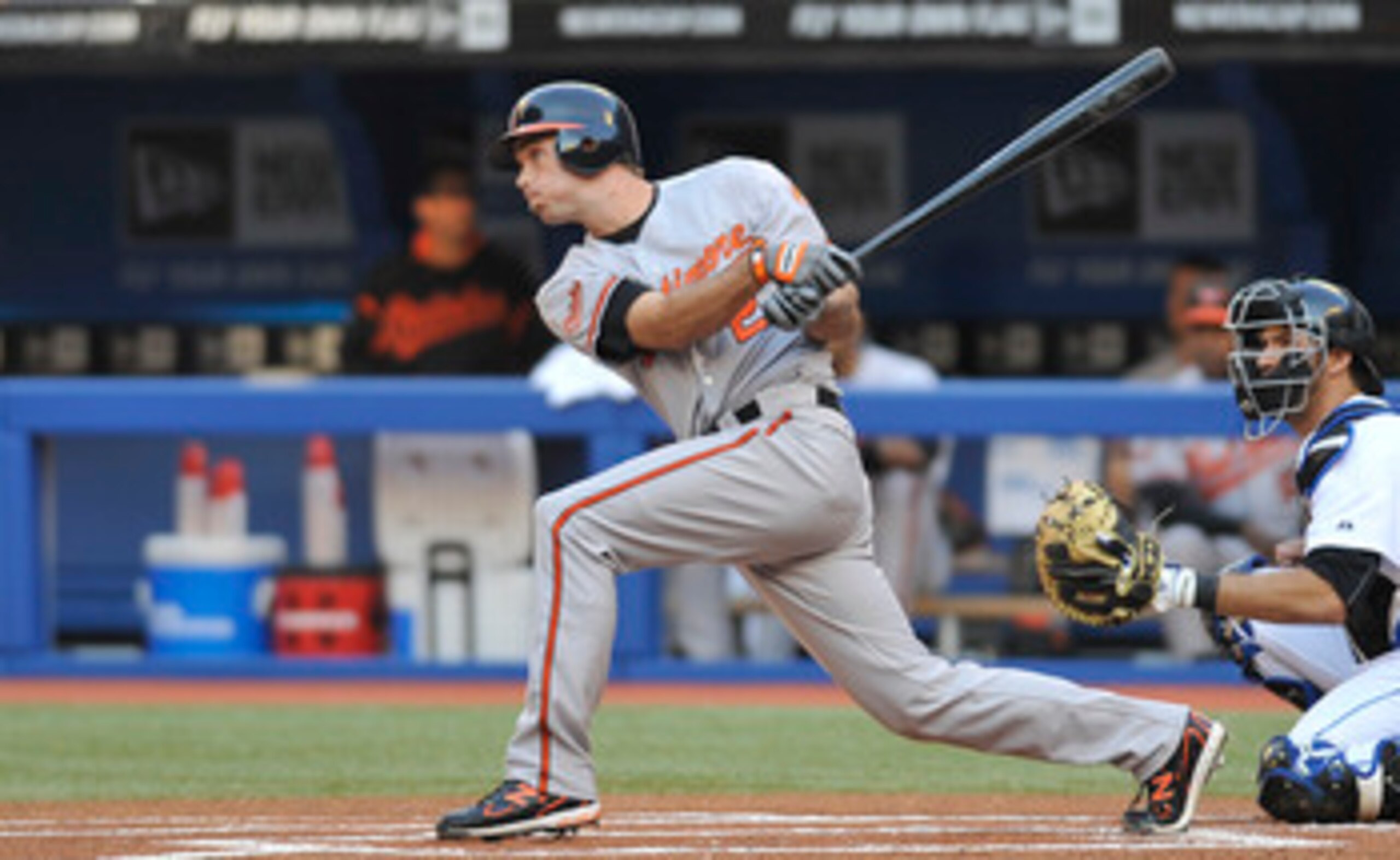 TORONTO, CANADA - JUNE 14:  J.J. Hardy #2 of the Baltimore Orioles swings at a pitch during game action against the Toronto Blue Jays June 14, 2011 at Rogers Centre in Toronto, Ontario, Canada. (Photo by Brad White/Getty Images)