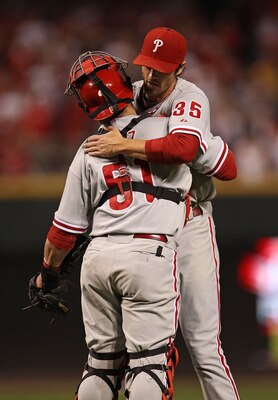 CINCINNATI - OCTOBER 10: Cole Hamels #35 of the Philadelphia Phillies hugs Carlos Ruiz #51 after throwing a complete game shut-out against the Cincinnati Reds during game 3 of the NLDS at Great American Ball Park on October 10, 2010 in Cincinnati, Ohio. T