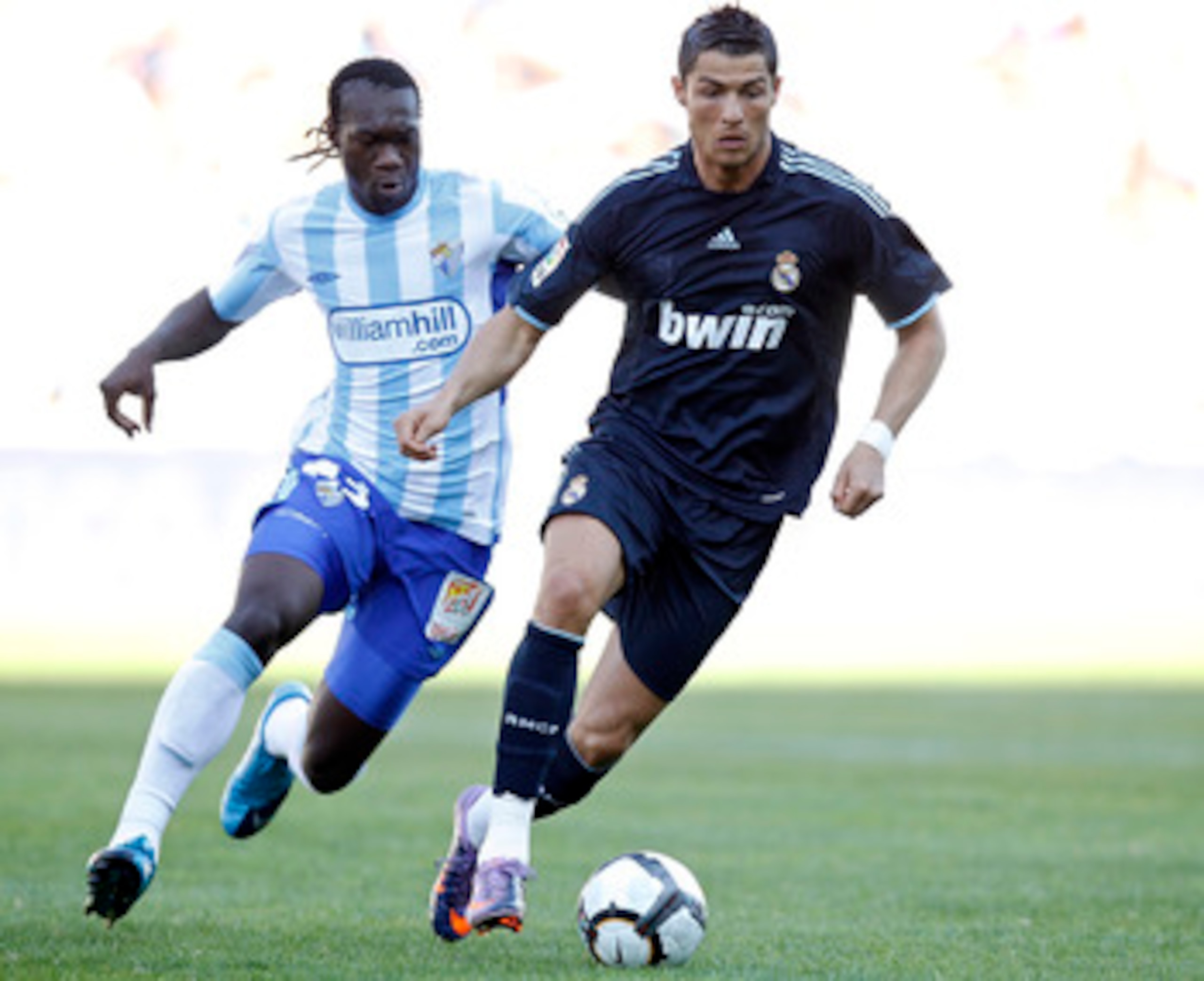 MALAGA, SPAIN - MAY 16: Cristiano Ronaldo of Real Madrid fights with Felipe Caicedo of Malaga during the La Liga match between Malaga and Real Madrid at La Rosaleda Stadium on May 16, 2010 in Malaga, Spain. (Photo by Angel Martinez/Getty Images) MALAGA, SPAIN - MAY 16: Cristiano Ronaldo of Real Madrid fights with Felipe Caicedo of Malaga during the La Liga match between Malaga and Real Madrid at La Rosaleda Stadium on May 16, 2010 in Malaga, Spain. (Photo by Angel Martinez/Getty Images)