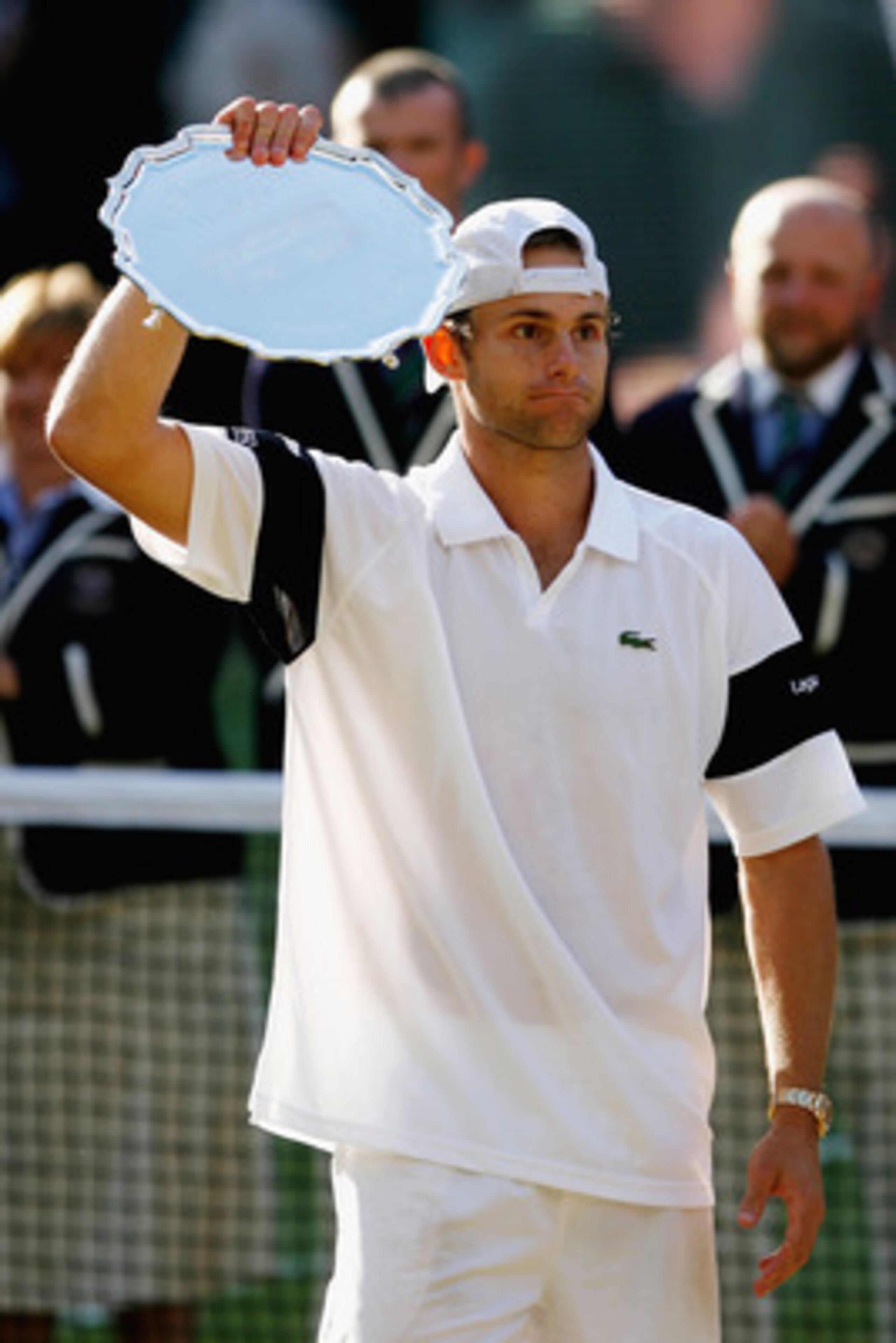 WIMBLEDON, ENGLAND - JULY 05:  Andy Roddick of USA looks despondent after defeat during the men's singles final match against Roger Federer of Switzerland on Day Thirteen of the Wimbledon Lawn Tennis Championships at the All England Lawn Tennis and Croque
