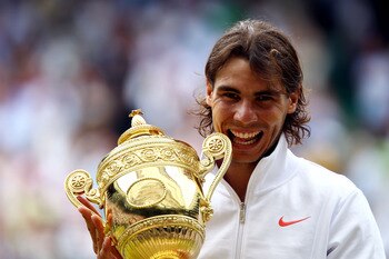 LONDON, ENGLAND - JULY 04: Rafael Nadal of Spain holds the Championship trophy after winning the Men's Singles Final match against Tomas Berdych of Czech Republic on Day Thirteen of the Wimbledon Lawn Tennis Championships at the All England Lawn Tennis a LONDON, ENGLAND - JULY 04: Rafael Nadal of Spain holds the Championship trophy after winning the Men's Singles Final match against Tomas Berdych of Czech Republic on Day Thirteen of the Wimbledon Lawn Tennis Championships at the All England Lawn Tennis a