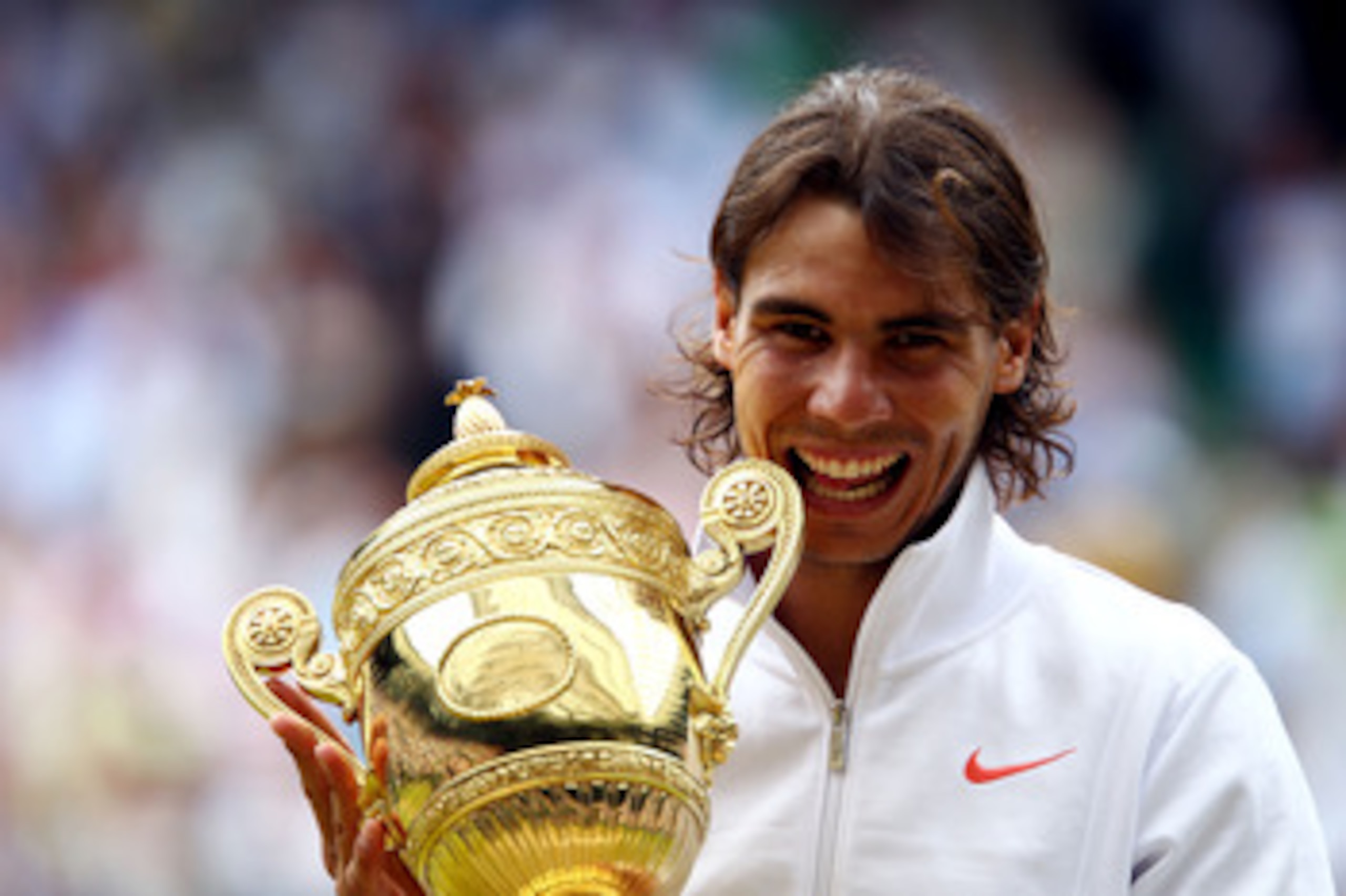 LONDON, ENGLAND - JULY 04:  Rafael Nadal of Spain holds the Championship trophy after winning the Men's Singles Final match against Tomas Berdych of Czech Republic on Day Thirteen of the Wimbledon Lawn Tennis Championships at the All England Lawn Tennis a