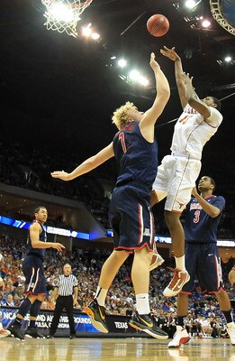 TULSA, OK - MARCH 20:  Tristan Thompson #13 of the Texas Longhorns takes a shot as Kyryl Natyazhko #1 of the Arizona Wildcats defends during the third round of the 2011 NCAA men's basketball tournament at BOK Center on March 20, 2011 in Tulsa, Oklahoma.  