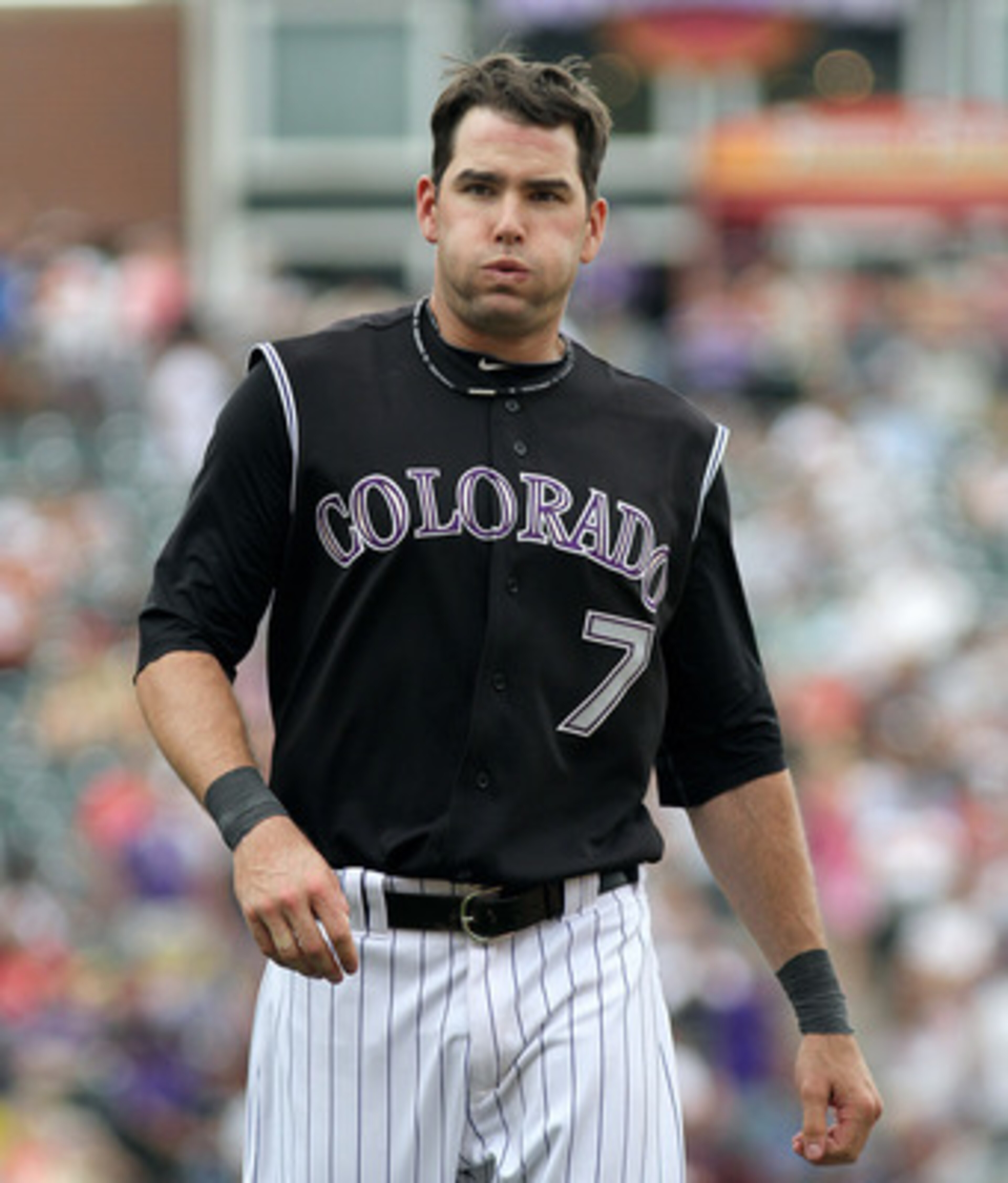 DENVER, CO - JUNE 12: Seth Smith #7 of the Colorado Rockies exhales after being left on base against the Los Angeles Dodgers on June 12, 2011 at Coors Field in Denver, Colorado. Smith had a three-run homer earlier in the game. The Dodgers won the game 10- DENVER, CO - JUNE 12: Seth Smith #7 of the Colorado Rockies exhales after being left on base against the Los Angeles Dodgers on June 12, 2011 at Coors Field in Denver, Colorado. Smith had a three-run homer earlier in the game. The Dodgers won the game 10-