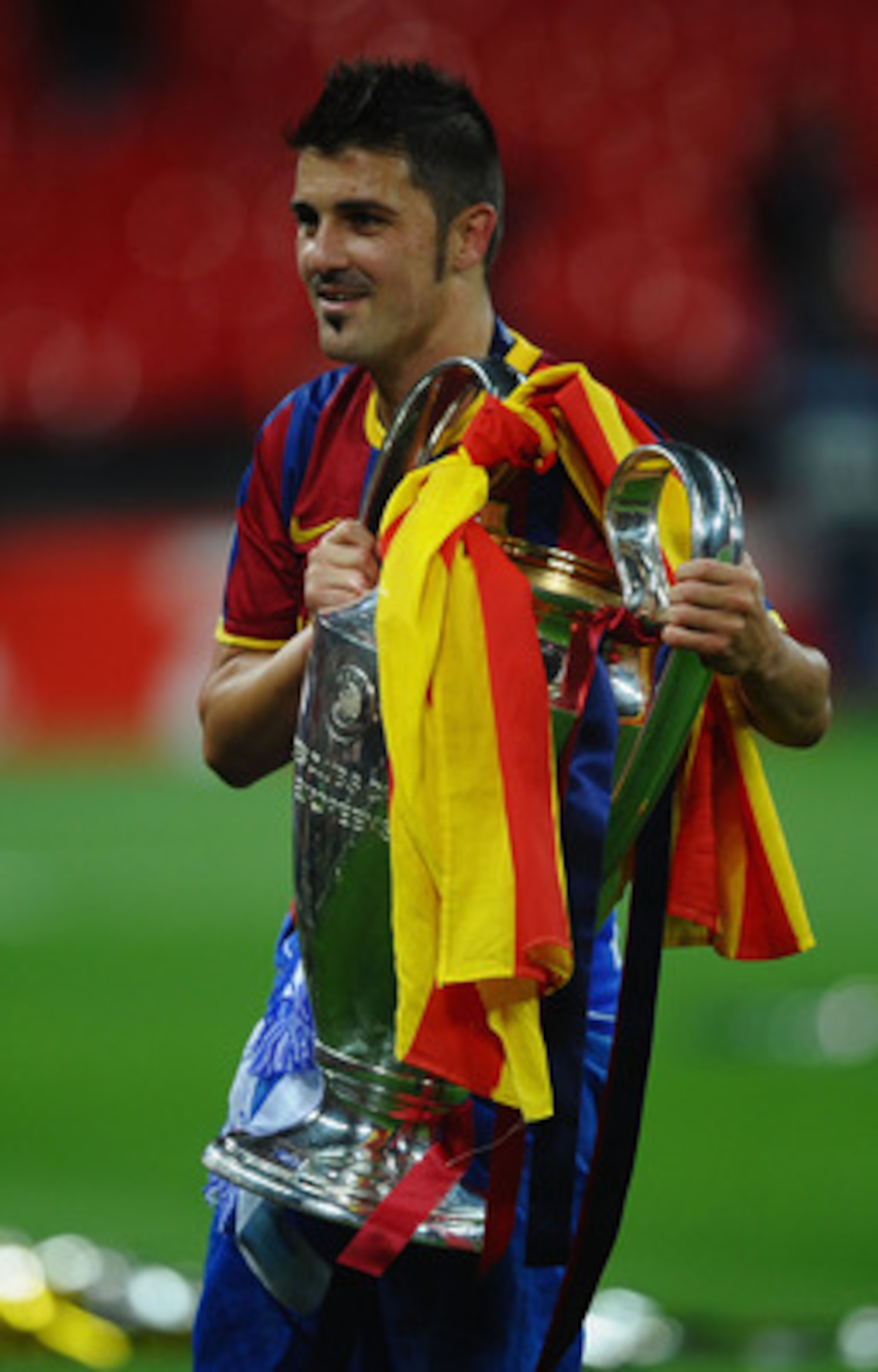 LONDON, ENGLAND - MAY 28:  David Villa of FC Barcelona poses with te trophy after victory in the UEFA Champions League final between FC Barcelona and Manchester United FC at Wembley Stadium on May 28, 2011 in London, England.  (Photo by Laurence Griffiths