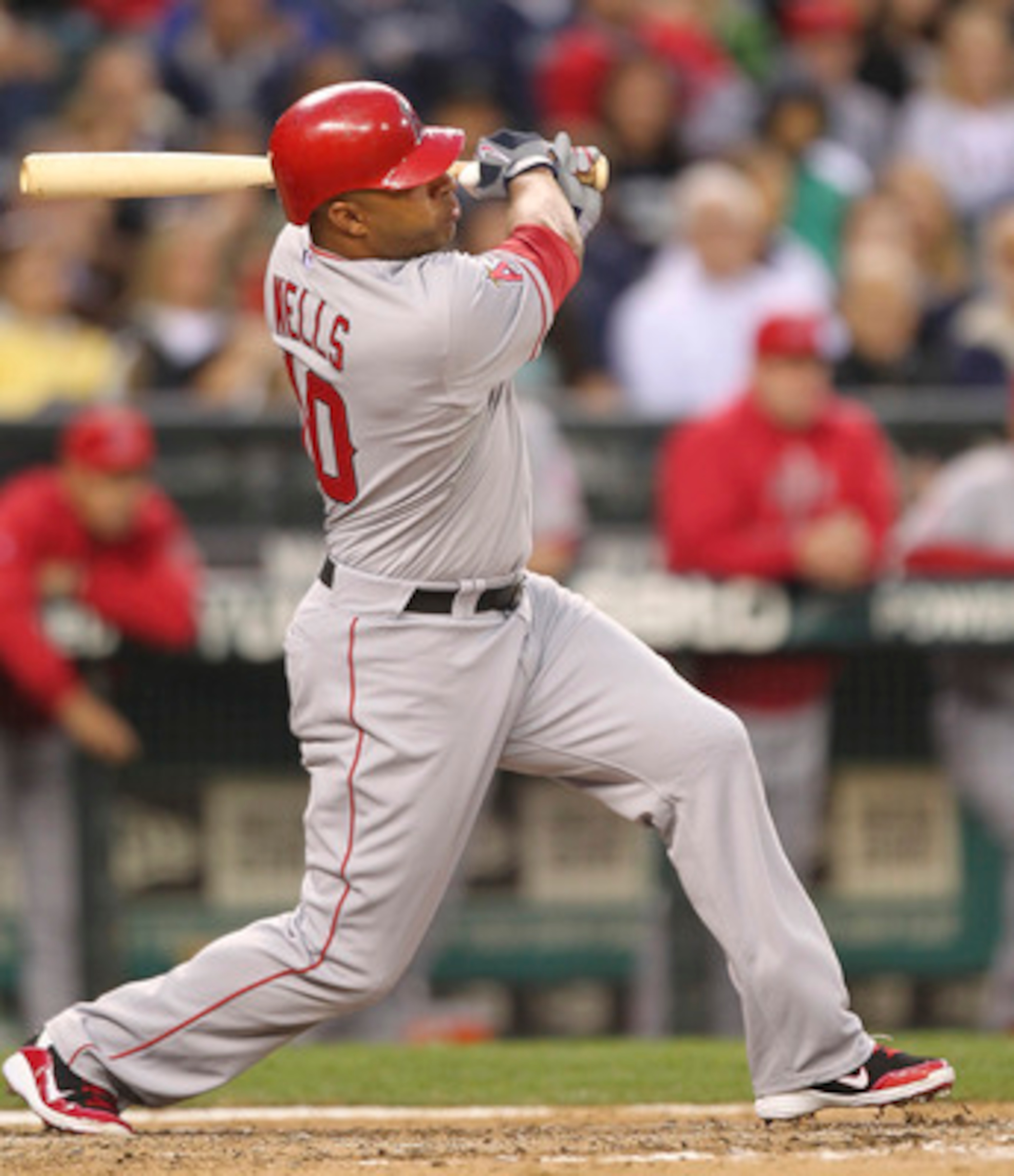 SEATTLE - JUNE 13: Vernon Wells #10 of the Los Angeles Angels of Anaheim hits a two-run homer in the seventh inning against the Seattle Mariners at Safeco Field on June 13, 2011 in Seattle, Washington. (Photo by Otto Greule Jr/Getty Images) SEATTLE - JUNE 13: Vernon Wells #10 of the Los Angeles Angels of Anaheim hits a two-run homer in the seventh inning against the Seattle Mariners at Safeco Field on June 13, 2011 in Seattle, Washington. (Photo by Otto Greule Jr/Getty Images)