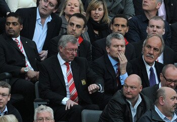 NEWCASTLE UPON TYNE, ENGLAND - APRIL 19:  Manchester United Manager Sir Alex Ferguson checks his watch from the stands during the Barclays Premier League match between Newcastle United and Manchester United at St James' Park on April 19, 2011 in Newcastle