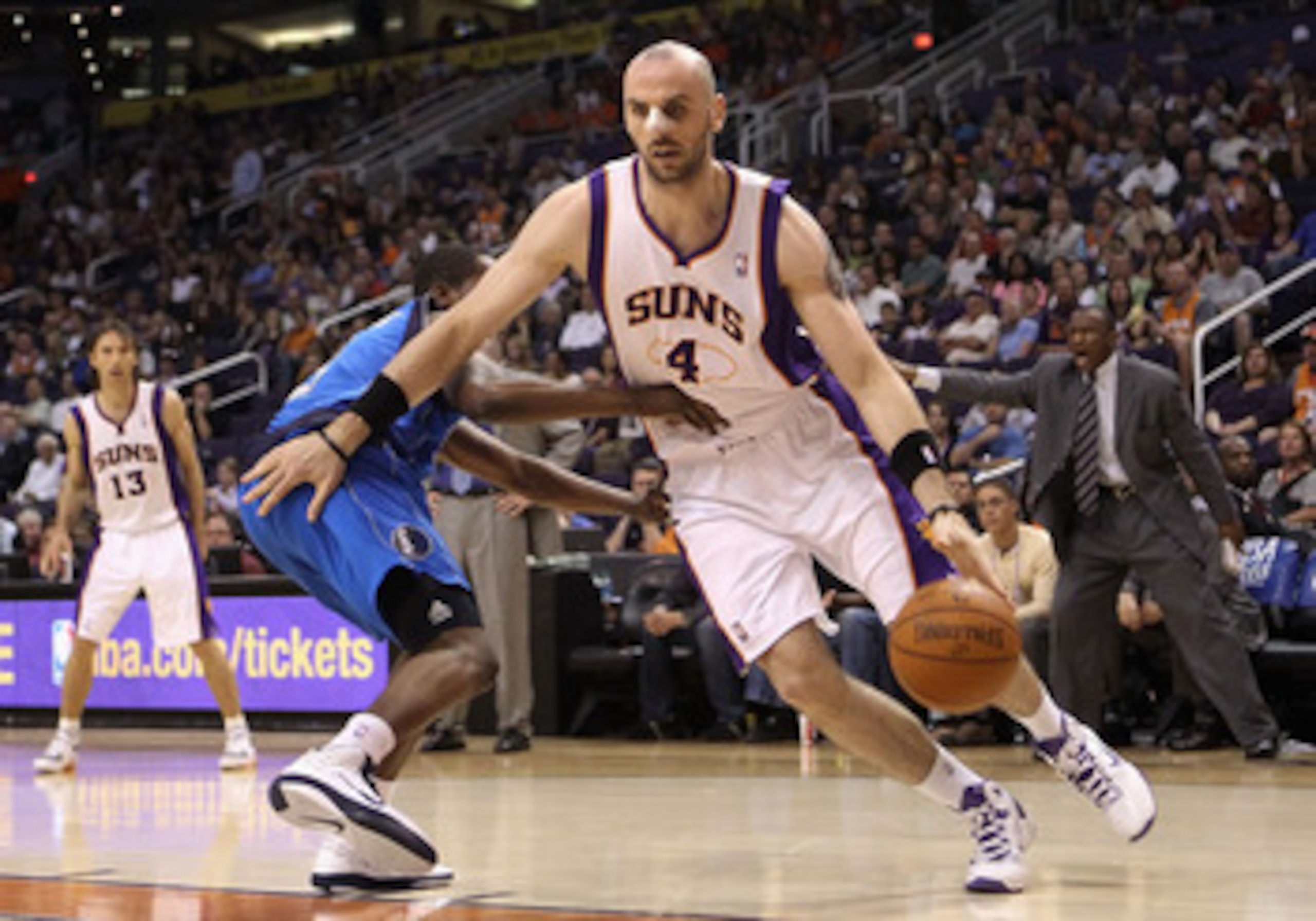 PHOENIX, AZ - MARCH 27:  Marcin Gortat #4 of the Phoenix Suns drives the ball during the NBA game against the Dallas Mavericks at US Airways Center on March 27, 2011 in Phoenix, Arizona.  NOTE TO USER: User expressly acknowledges and agrees that, by downl