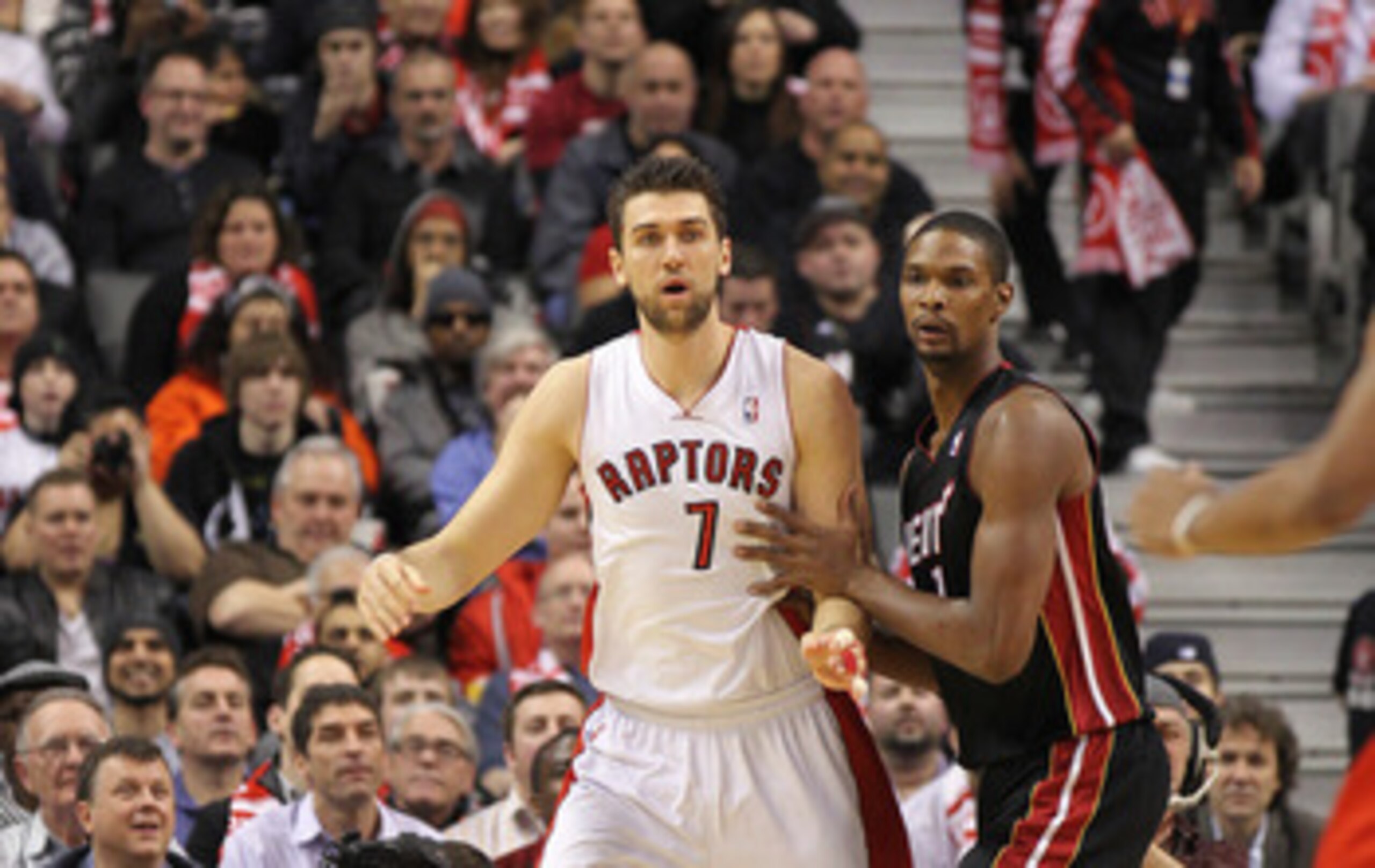 TORONTO, CANADA - FEBRUARY 16:  Chris Bosh #1 of the Miami Heat plays against Andrea Bargnani #7 of the Toronto Raptors in a game on February 16, 2011 at the Air Canada Centre in Toronto, Canada. The Heat defeated the Raptors 103-95. (Photo by Claus Ander
