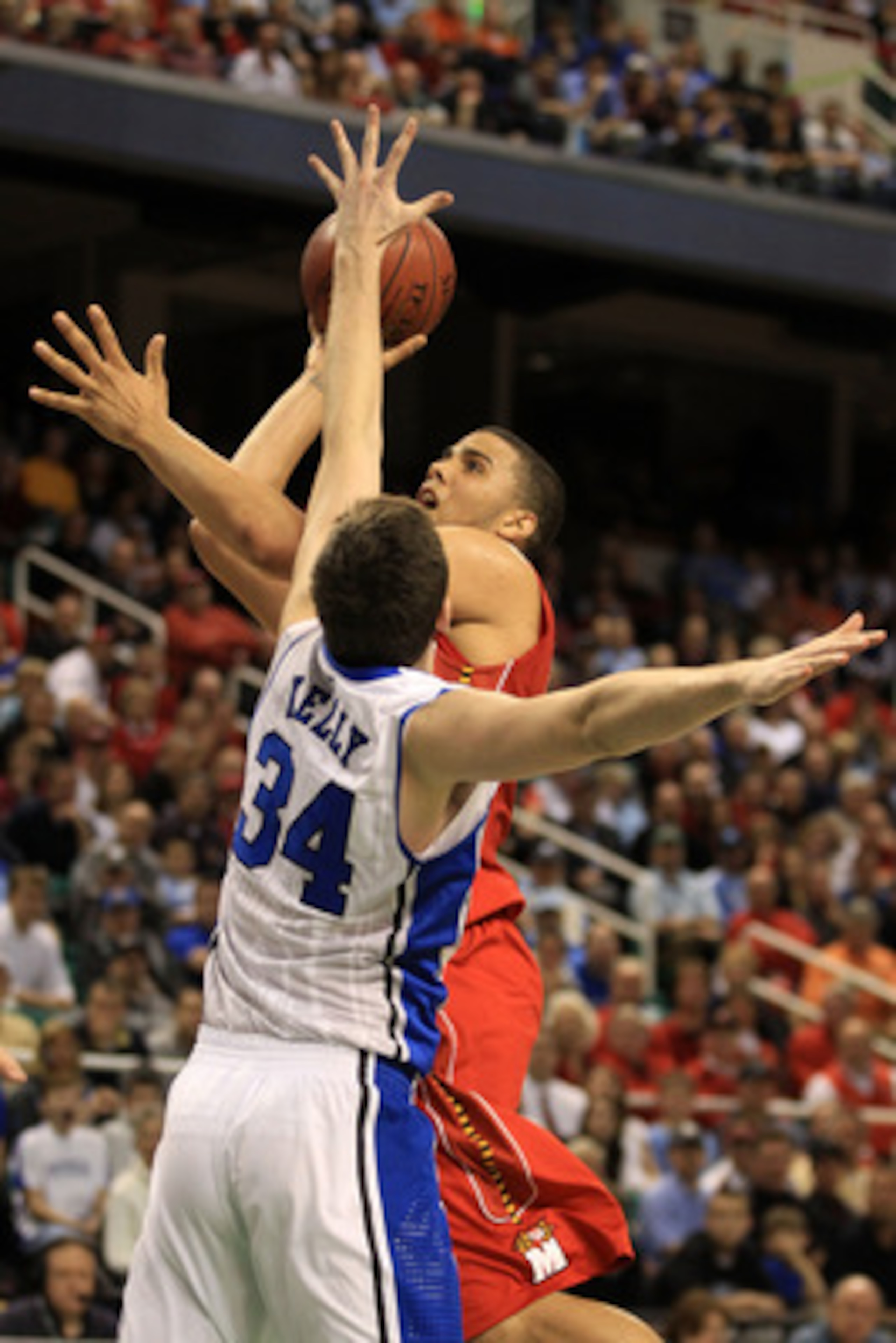 GREENSBORO, NC - MARCH 11: Jordan Williams #20 of the Maryland Terrapins shoots against Ryan Kelly #34 of the Duke Blue Devils during the first half in the quarterfinals of the 2011 ACC men's basketball tournament at the Greensboro Coliseum on March 11, GREENSBORO, NC - MARCH 11: Jordan Williams #20 of the Maryland Terrapins shoots against Ryan Kelly #34 of the Duke Blue Devils during the first half in the quarterfinals of the 2011 ACC men's basketball tournament at the Greensboro Coliseum on March 11,