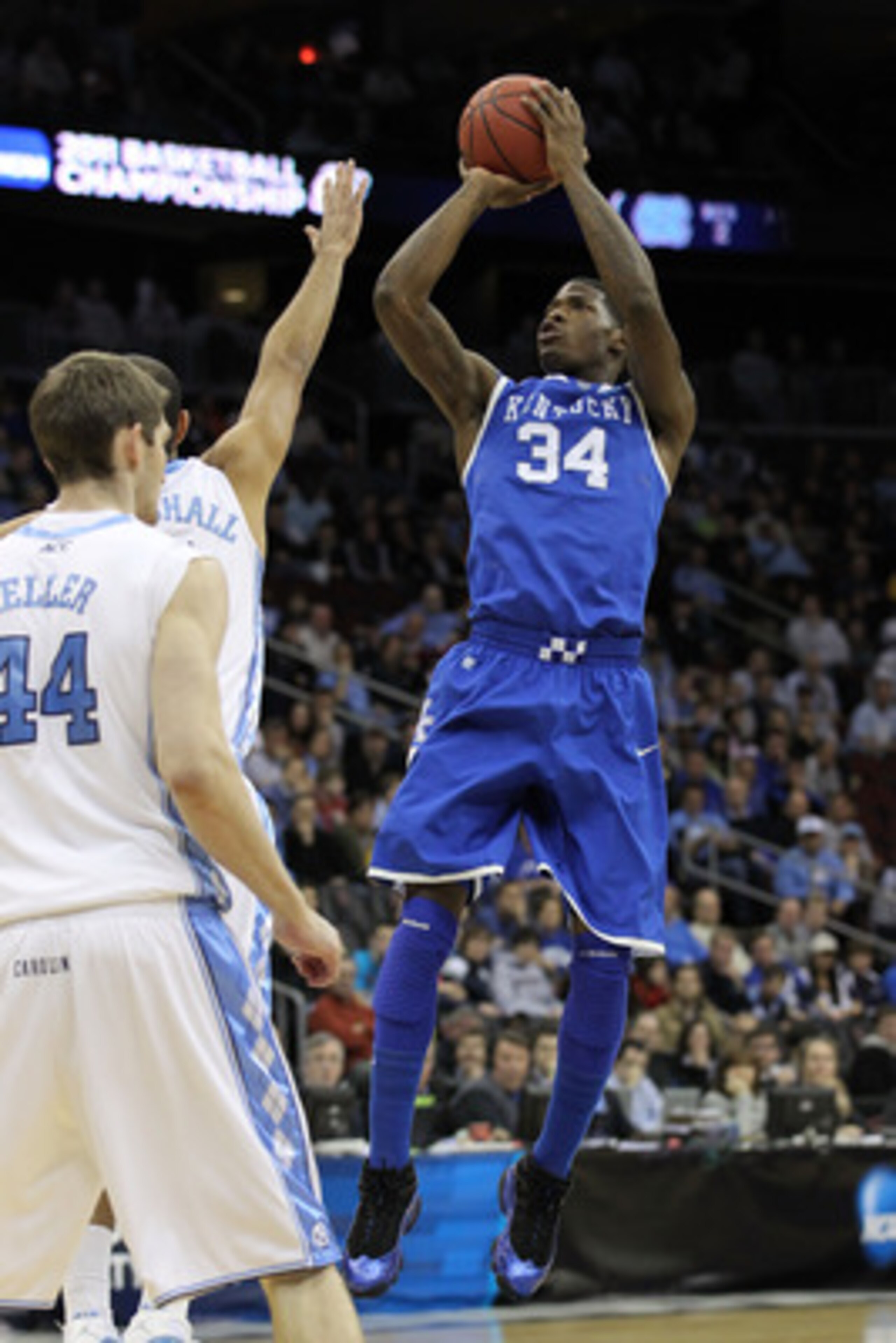NEWARK, NJ - MARCH 27: DeAndre Liggins #34 of the Kentucky Wildcats takes a jump shot against Kendall Marshall #5 of the North Carolina Tar Heels during the first half of the east regional final of the 2011 NCAA men's basketball tournament at Prudential NEWARK, NJ - MARCH 27: DeAndre Liggins #34 of the Kentucky Wildcats takes a jump shot against Kendall Marshall #5 of the North Carolina Tar Heels during the first half of the east regional final of the 2011 NCAA men's basketball tournament at Prudential