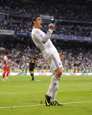 MADRID, SPAIN - MAY 21:  Cristiano Ronaldo of Real Madrid celebrates after scoring his 2nd goal during the La Liga match between Real Madrid and UD Almeria at Estadio Santiago Bernabeu on May 21, 2011 in Madrid, Spain.  (Photo by Denis Doyle/Getty Images)