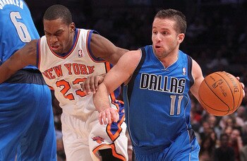 NEW YORK, NY - FEBRUARY 02: Jose Barea #11 of the Dallas Mavericks drives past Toney Douglas #23   of the New York Knicks  at Madison Square Garden on February 2, 2011 in New York City. NOTE TO USER: User expressly acknowledges and agrees that, by downloa