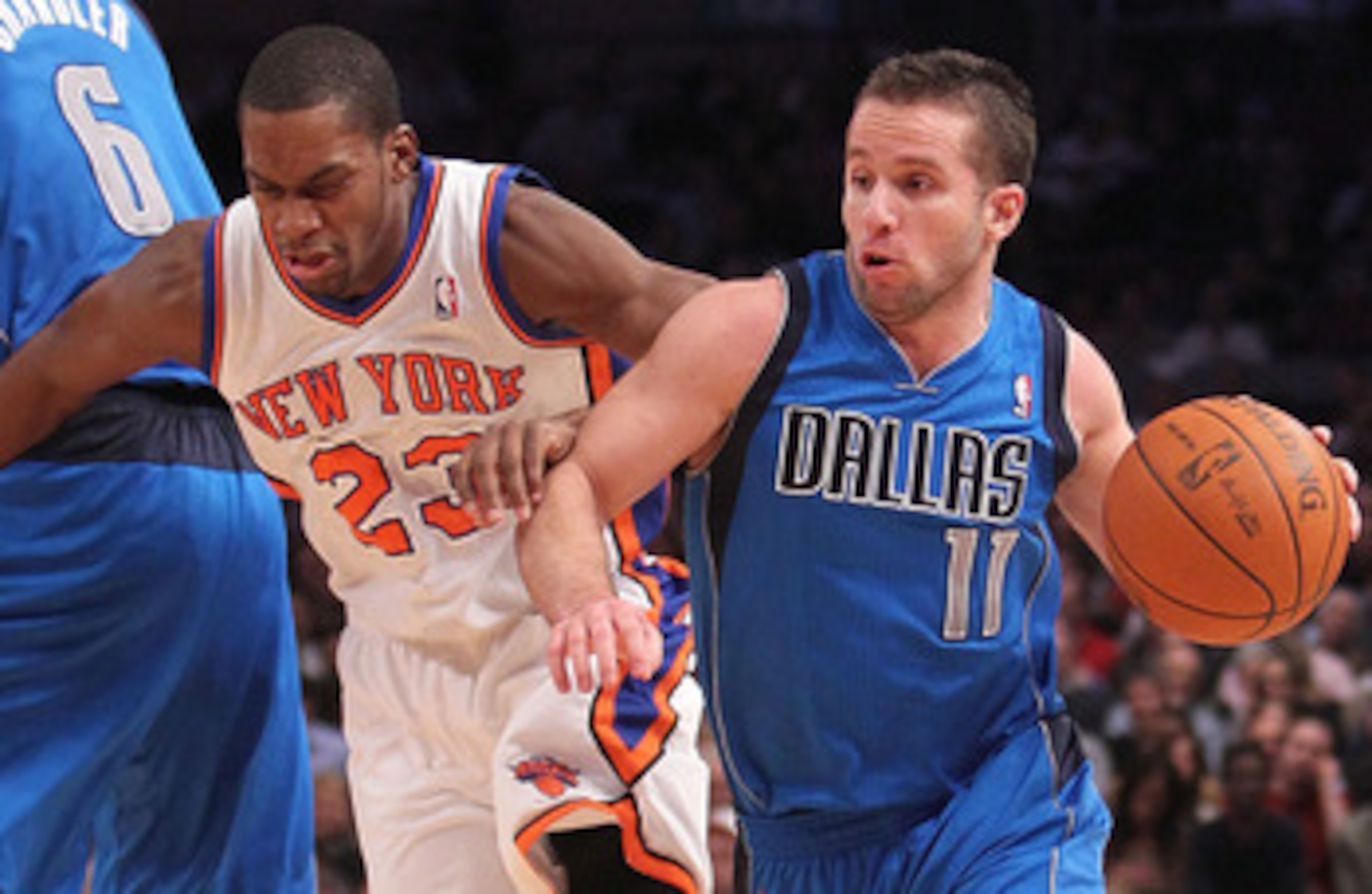 NEW YORK, NY - FEBRUARY 02: Jose Barea #11 of the Dallas Mavericks drives past Toney Douglas #23   of the New York Knicks  at Madison Square Garden on February 2, 2011 in New York City. NOTE TO USER: User expressly acknowledges and agrees that, by downloa