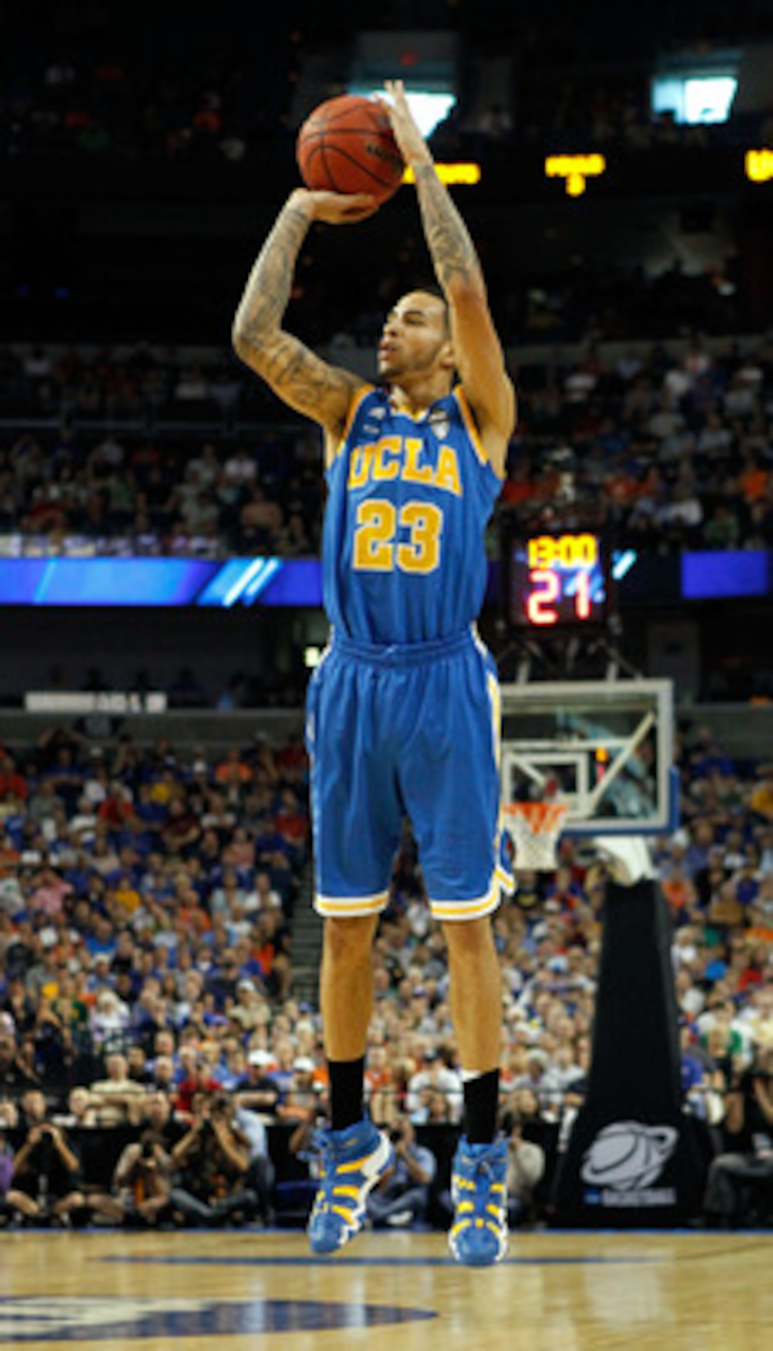 TAMPA, FL - MARCH 19:  Tyler Honeycutt #23 of the UCLA Bruins attempts a shot against the Florida Gators during the third round of the 2011 NCAA men's basketball tournament at St. Pete Times Forum on March 19, 2011 in Tampa, Florida.  (Photo by J. Meric/G
