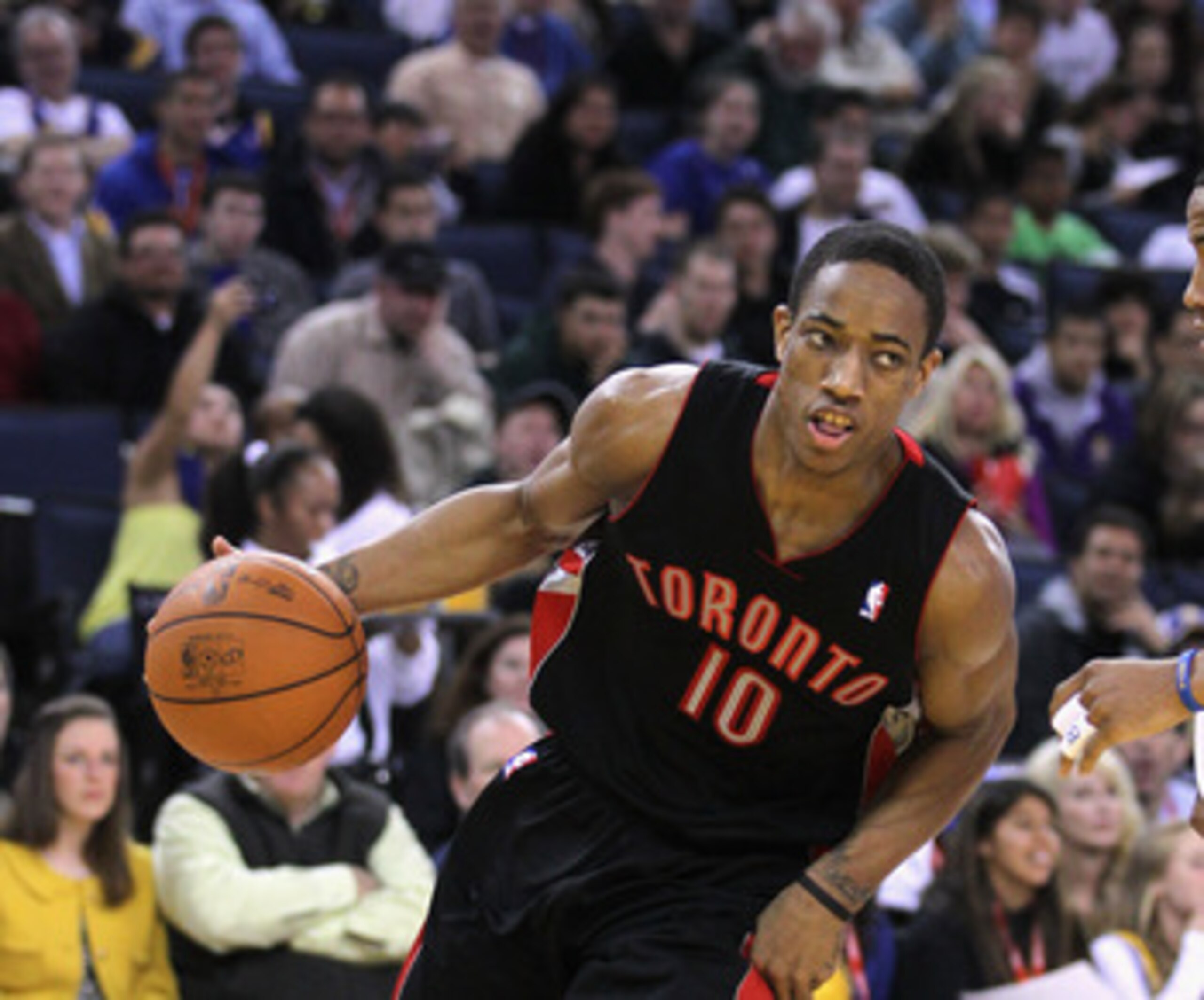 OAKLAND, CA - MARCH 25: DeMar DeRozan #10 of the Toronto Raptors in action against the Golden State Warriors at Oracle Arena on March 25, 2011 in Oakland, California. NOTE TO USER: User expressly acknowledges and agrees that, by downloading and or using t