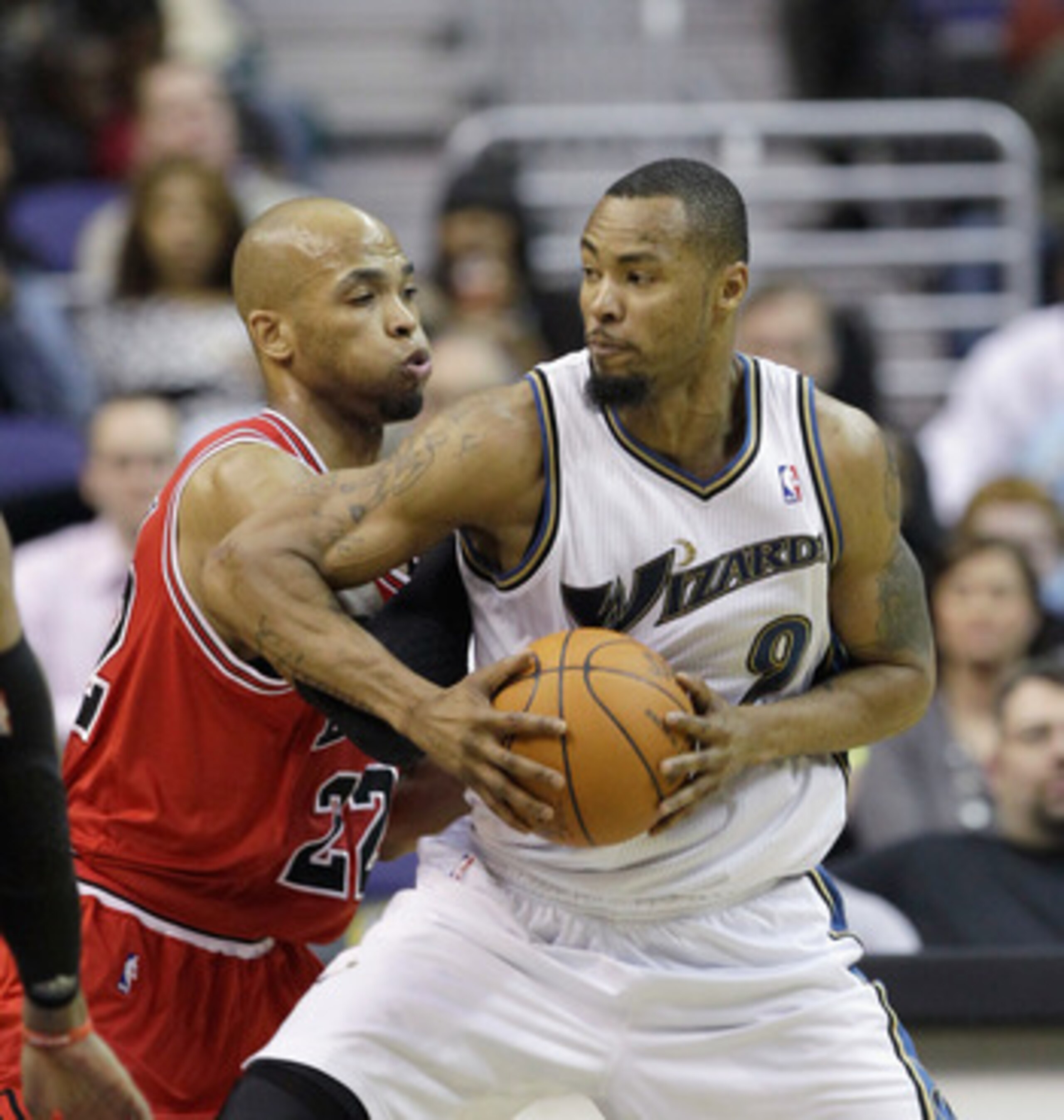WASHINGTON, DC - FEBRUARY 28: Taj Gibson #22 of the Chicago Bulls guards Rashard Lewis #9 of the Washington Wizards at the Verizon Center in Washington on February 28, 2011 in Washington, DC. NOTE TO USER: User expressly acknowledges and agrees that, by d