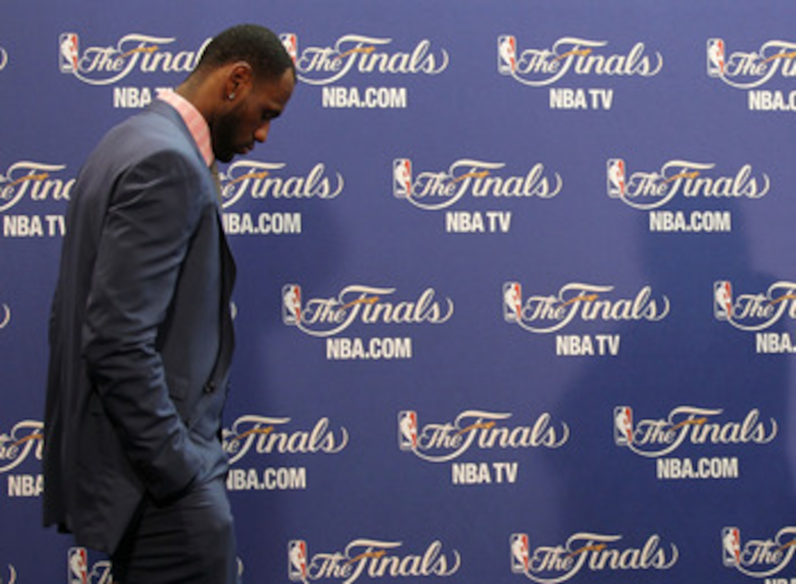 MIAMI, FL - JUNE 12:  LeBron James #6 of the Miami Heat walks into the interview room to answer questions after the Heat were defeated 105-95 by the Dallas Mavericks in Game Six of the 2011 NBA Finals at American Airlines Arena on June 12, 2011 in Miami,