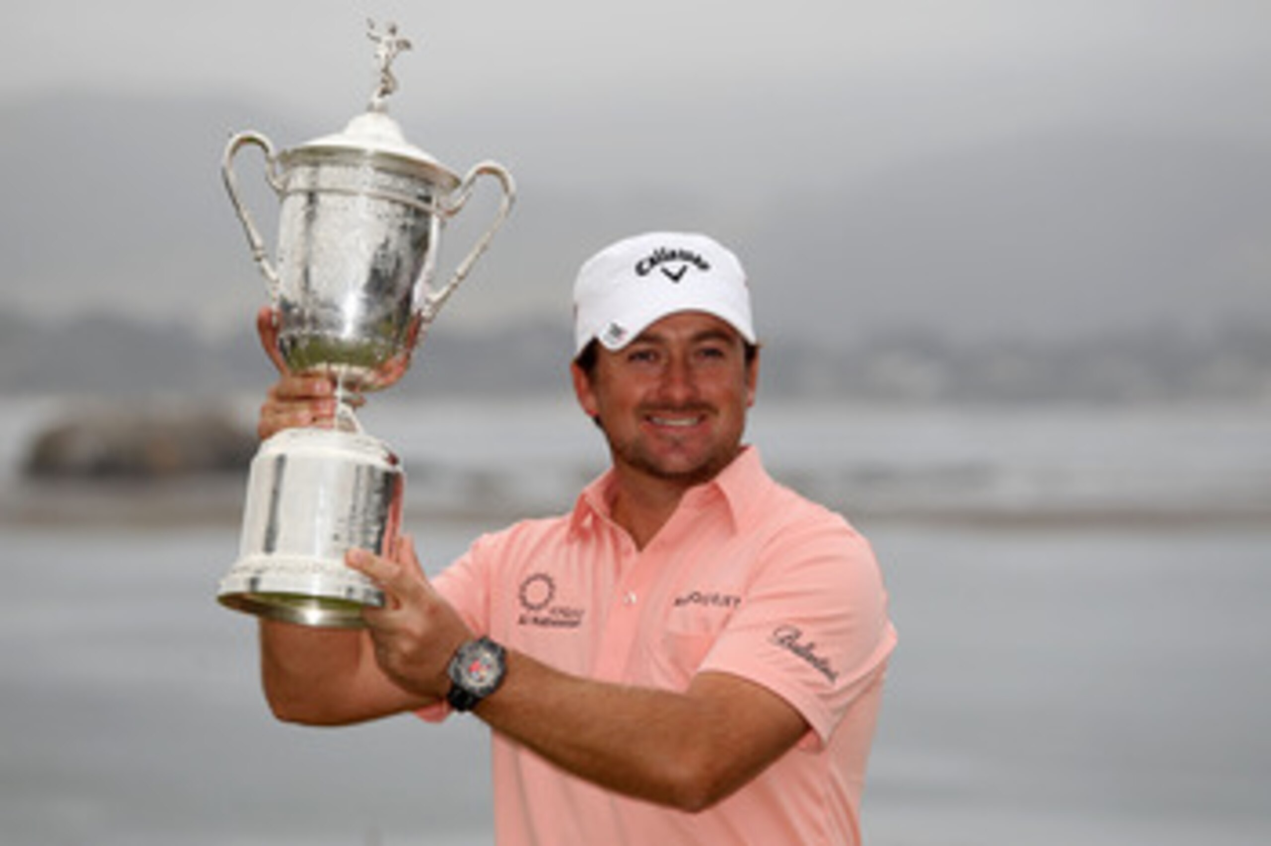 PEBBLE BEACH, CA - JUNE 20:  Graeme McDowell (R) of Northern Ireland celebrates with the trophy on the 18th green after winning the 110th U.S. Open at Pebble Beach Golf Links on June 20, 2010 in Pebble Beach, California.  (Photo by Ross Kinnaird/Getty Ima