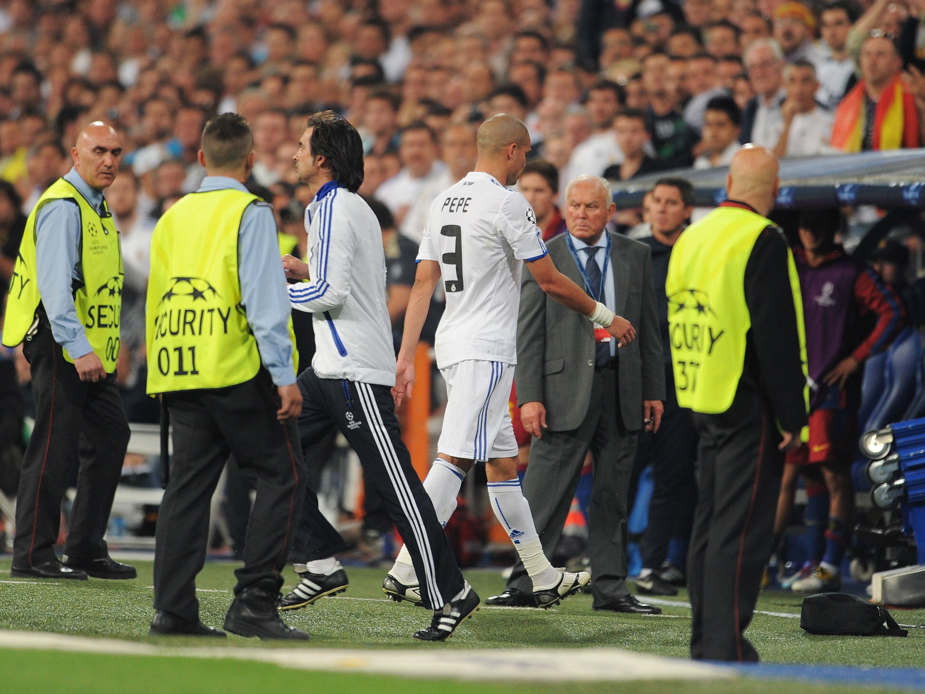 MADRID, SPAIN - APRIL 27:  Pepe (C) of Real Madrid walks off the pitch after receiving a red card for fouling Daniel Alves of Barcelona during the UEFA Champions League Semi Final first leg match between Real Madrid and Barcelona at the Estadio Santiago B