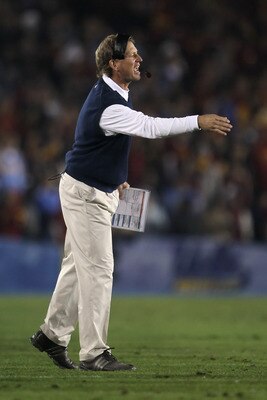 PASADENA, CA - DECEMBER 04: UCLA Bruins head coach Rick Neuheisel yells from the sideline against the USC Trojans at the Rose Bowl on December 4, 2010 in Pasadena, California. USC defeated UCLA 28-14. (Photo by Jeff Gross/Getty Images) PASADENA, CA - DECEMBER 04: UCLA Bruins head coach Rick Neuheisel yells from the sideline against the USC Trojans at the Rose Bowl on December 4, 2010 in Pasadena, California. USC defeated UCLA 28-14. (Photo by Jeff Gross/Getty Images)