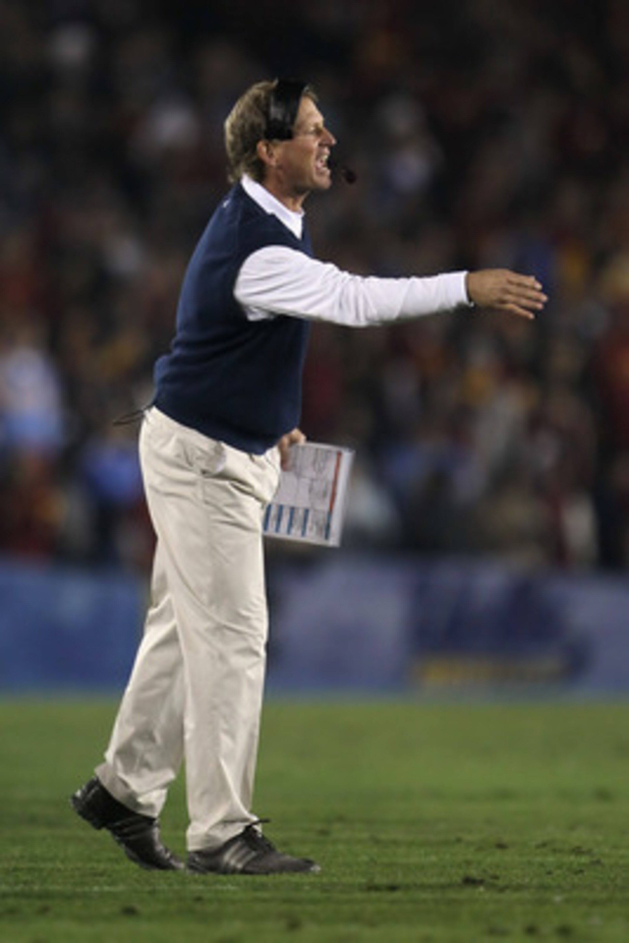 PASADENA, CA - DECEMBER 04: UCLA Bruins head coach Rick Neuheisel yells from the sideline against the USC Trojans at the Rose Bowl on December 4, 2010 in Pasadena, California. USC defeated UCLA 28-14. (Photo by Jeff Gross/Getty Images) PASADENA, CA - DECEMBER 04: UCLA Bruins head coach Rick Neuheisel yells from the sideline against the USC Trojans at the Rose Bowl on December 4, 2010 in Pasadena, California. USC defeated UCLA 28-14. (Photo by Jeff Gross/Getty Images)