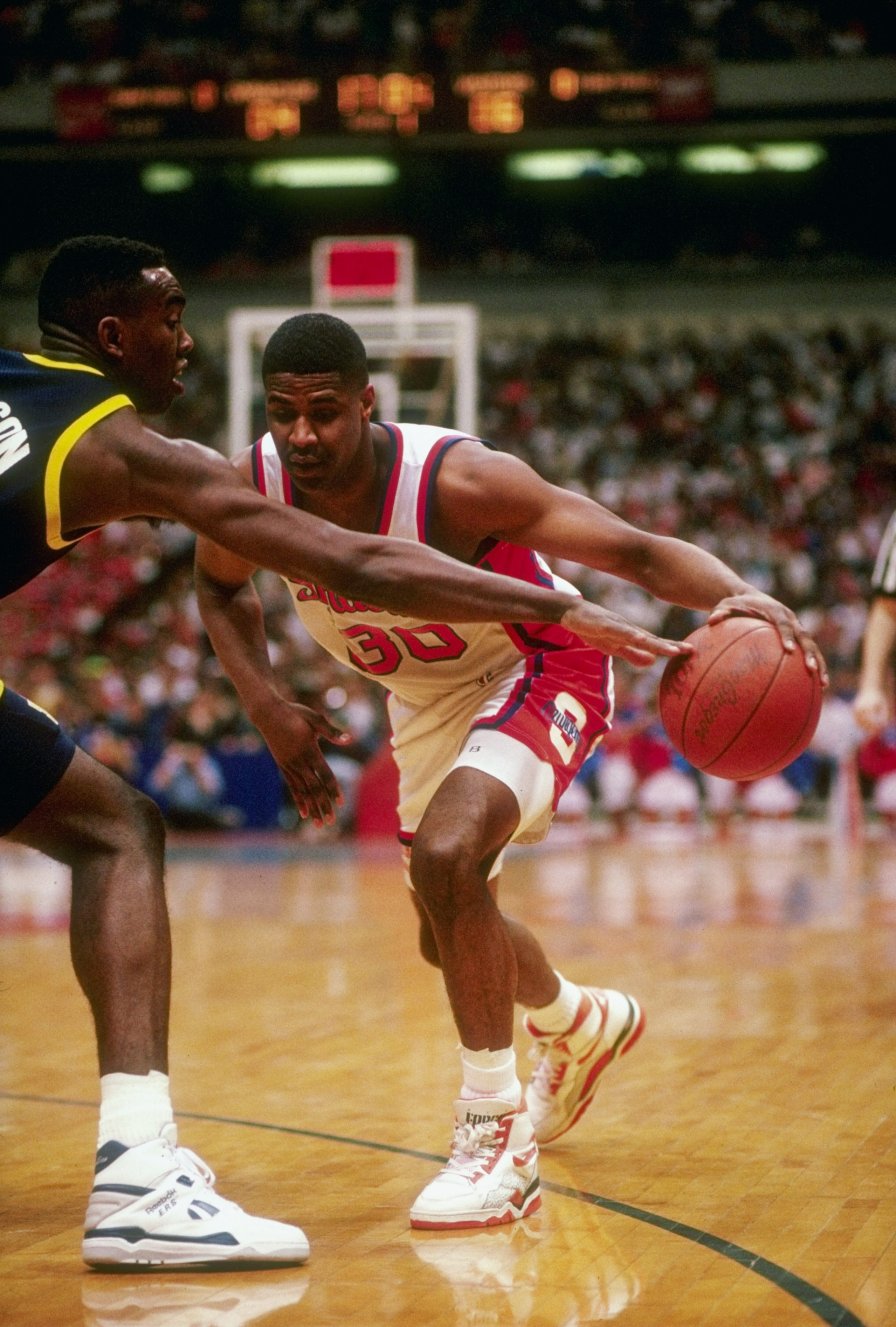 Forward Billy Owens of the Syracuse Orangemen moves the ball during a game.
