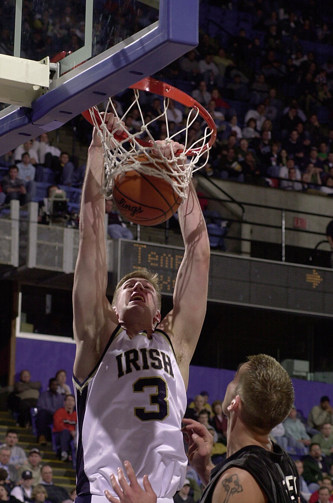 16 Mar 2001:  Troy Murphy #3 of Notre Dame dunks the ball as Kevin Frey #3 of Xavier looks on during the first round of the NCAA Men's College Basketball Championship at Kemper Arena in Kansas City, Missouri. DIGITAL IMAGE. Mandatory Credit: Elsa/ALLSPORT
