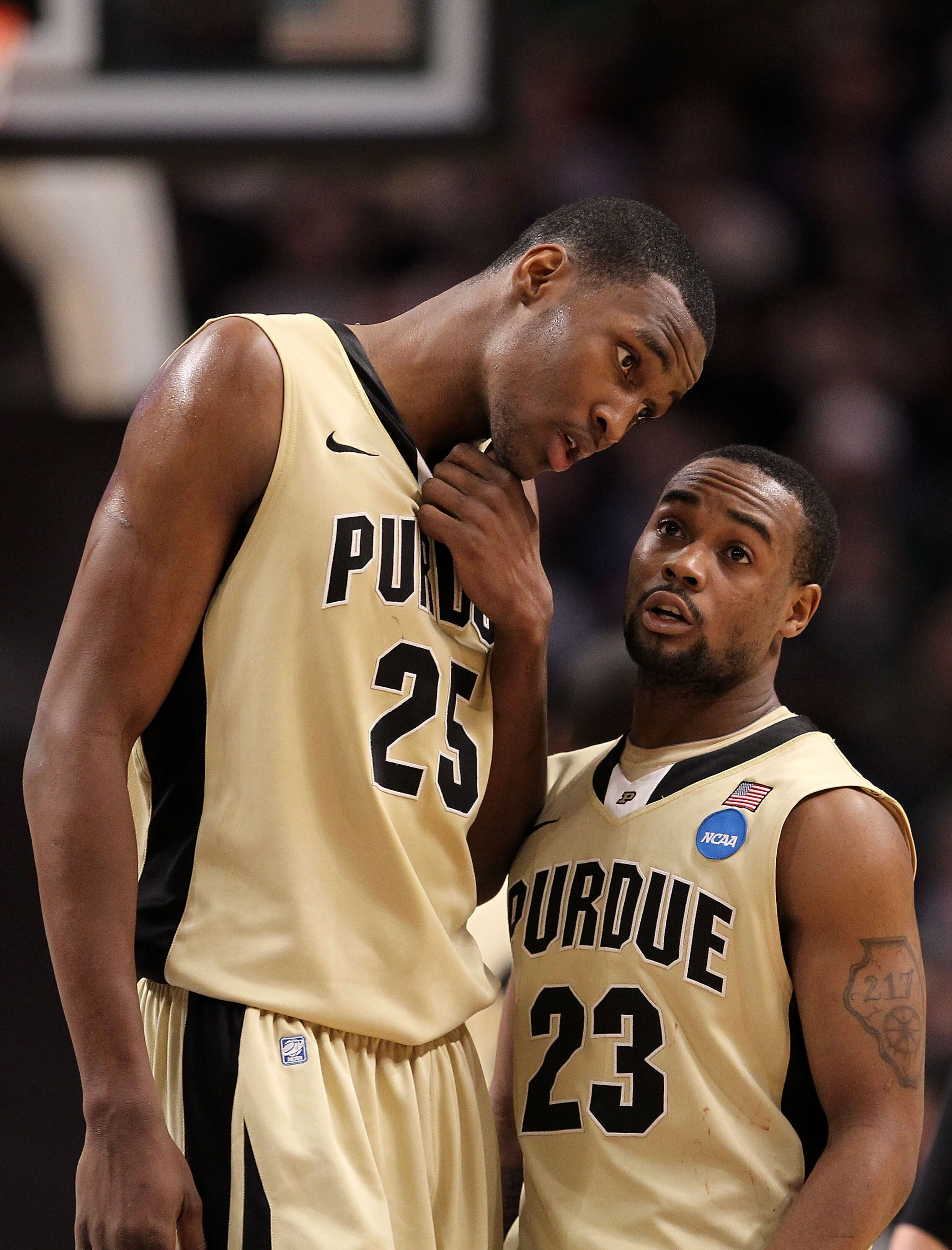 CHICAGO, IL - MARCH 20:  JaJuan Johnson #25 and Lewis Jackson #23 of the Purdue Boilermakers look on in the second half against the Virginia Commonwealth Rams during the third round of the 2011 NCAA men's basketball tournament at the United Center on Marc