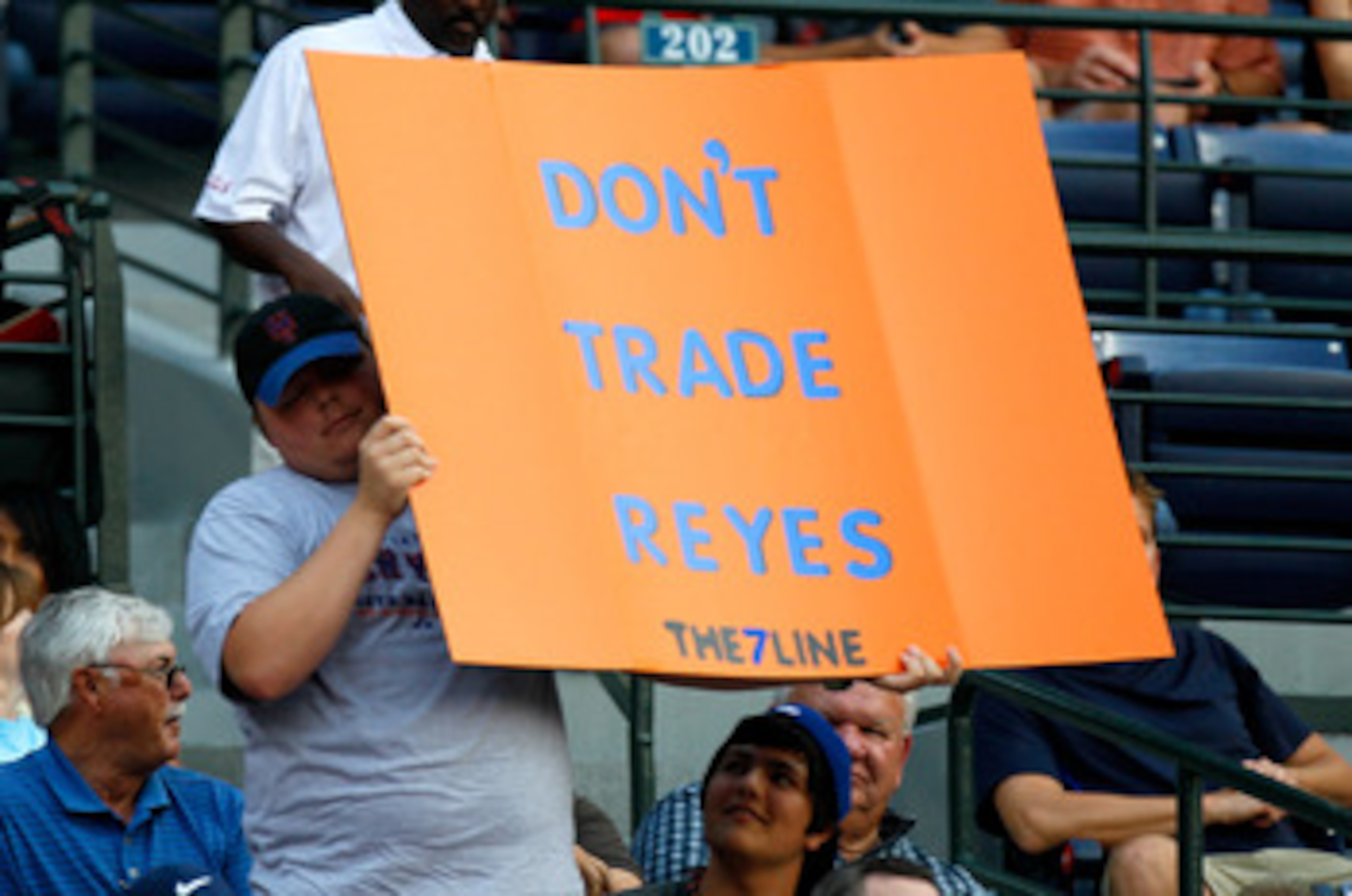 ATLANTA, GA - JUNE 14:  A young New York Mets fan holds up a sign with the words 'Don't Trade Reyes' during the game against the Atlanta Braves at Turner Field on June 14, 2011 in Atlanta, Georgia.  (Photo by Kevin C. Cox/Getty Images)
