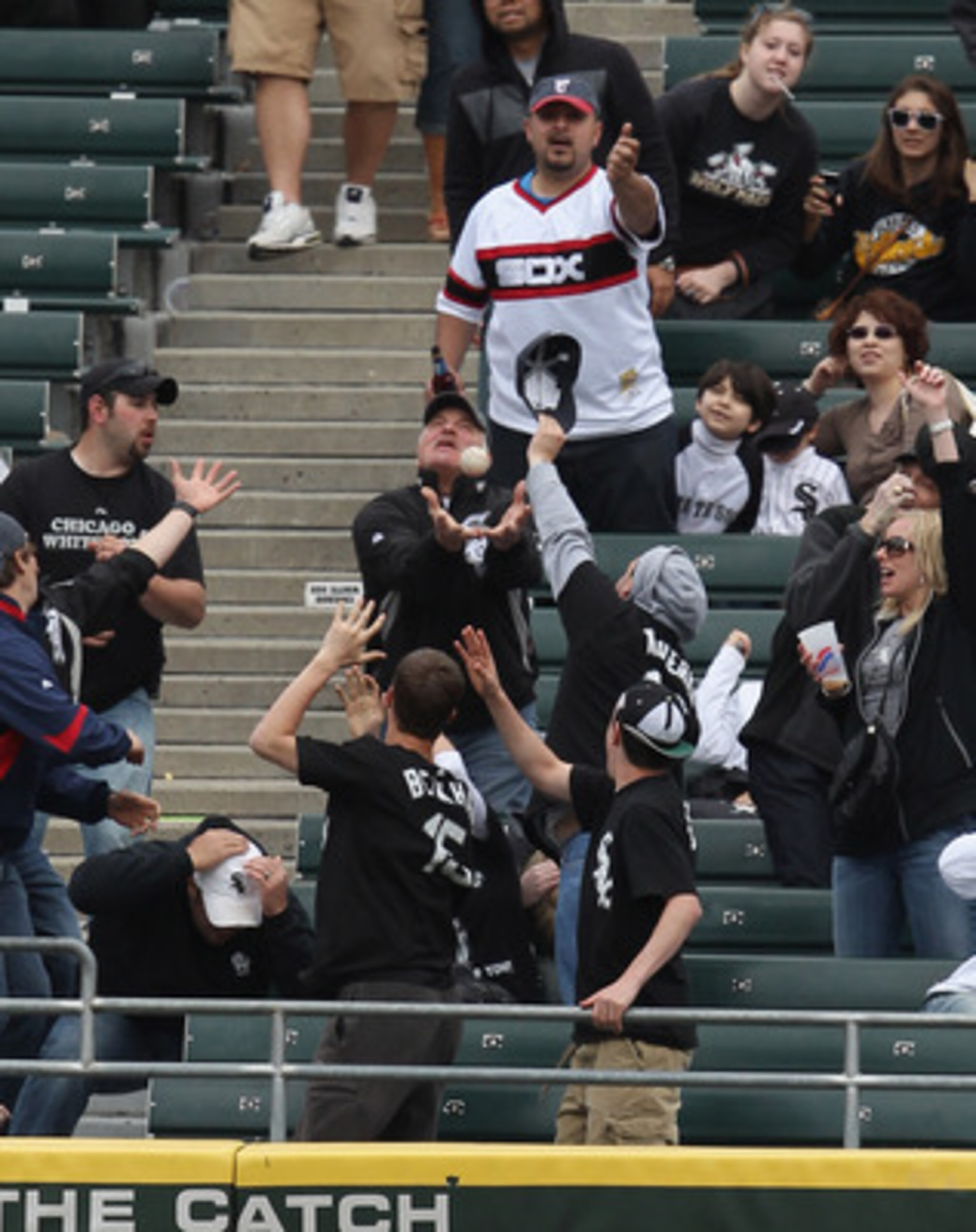 CHICAGO, IL - MAY 01: Fans of the Chicago White Sox scramble for a home run ball hit by Adam Dunn in the 8th inning against the Baltimore Orioles at U.S. Cellular Field on May 1, 2011 in Chicago, Illinois. The Orioles defeated the White Sox 6-4. (Photo by
