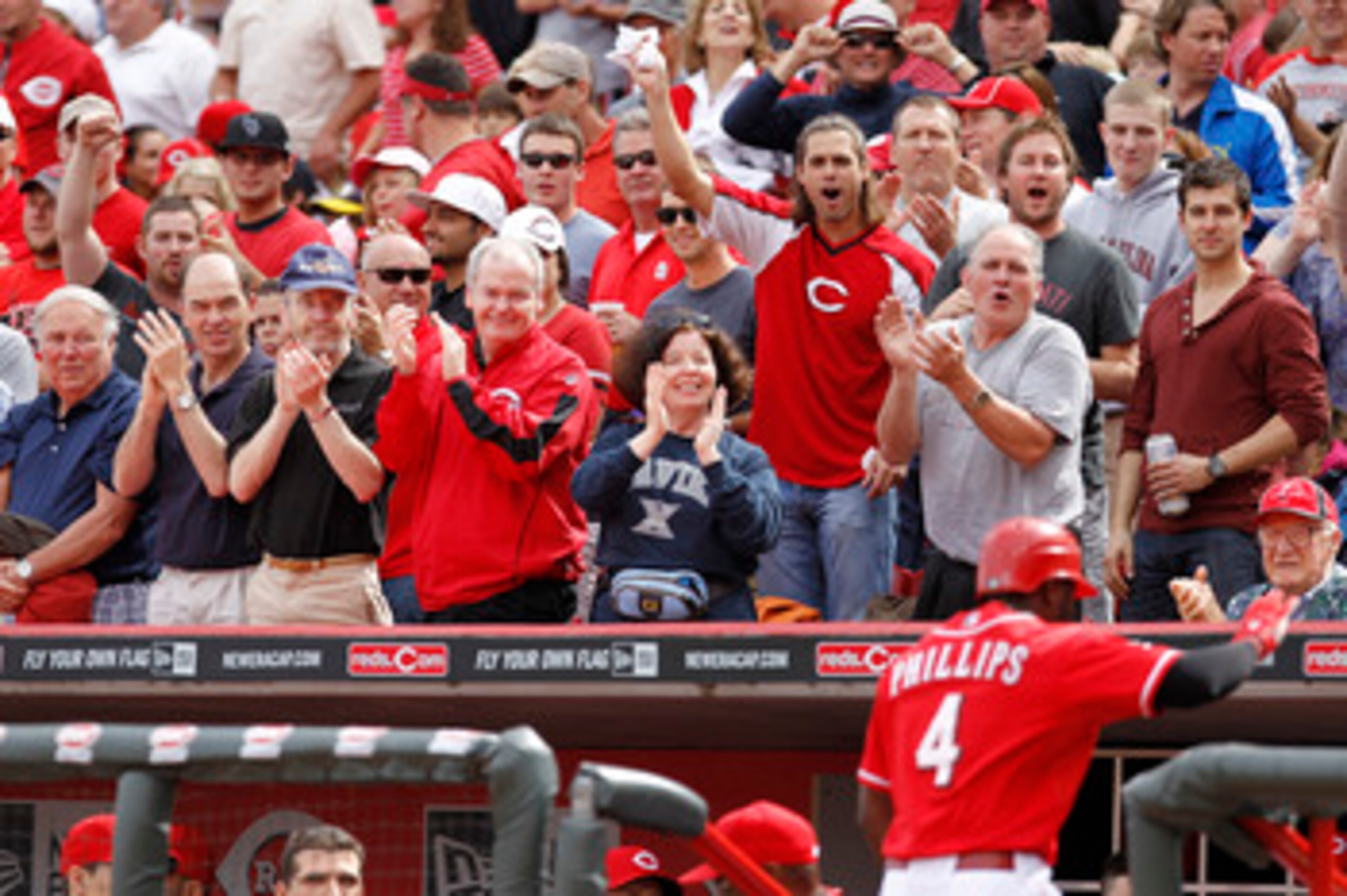 CINCINNATI, OH - MAY 14: Fans cheer as Brandon Phillips #4 of the Cincinnati Reds returns to the dugout after hitting a home run in the second inning against the St. Louis Cardinals at Great American Ball Park on May 14, 2011 in Cincinnati, Ohio. The Reds