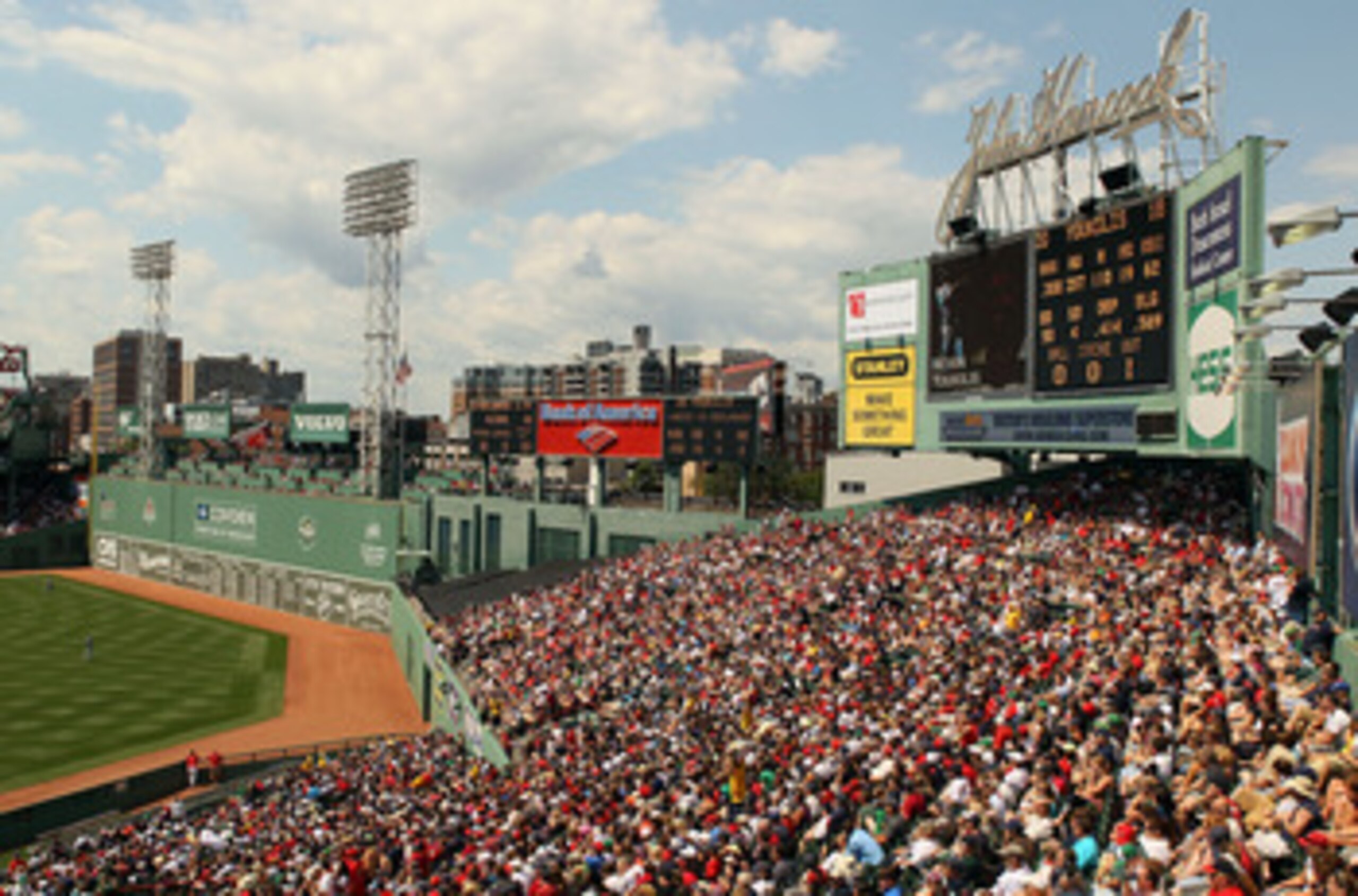 BOSTON - AUGUST 01:  Fans enjoy the game between the Detroit Tigers and the Boston Red Sox from the bleacher seats on August 1, 2010 at Fenway Park in Boston, Massachusetts.  (Photo by Elsa/Getty Images)