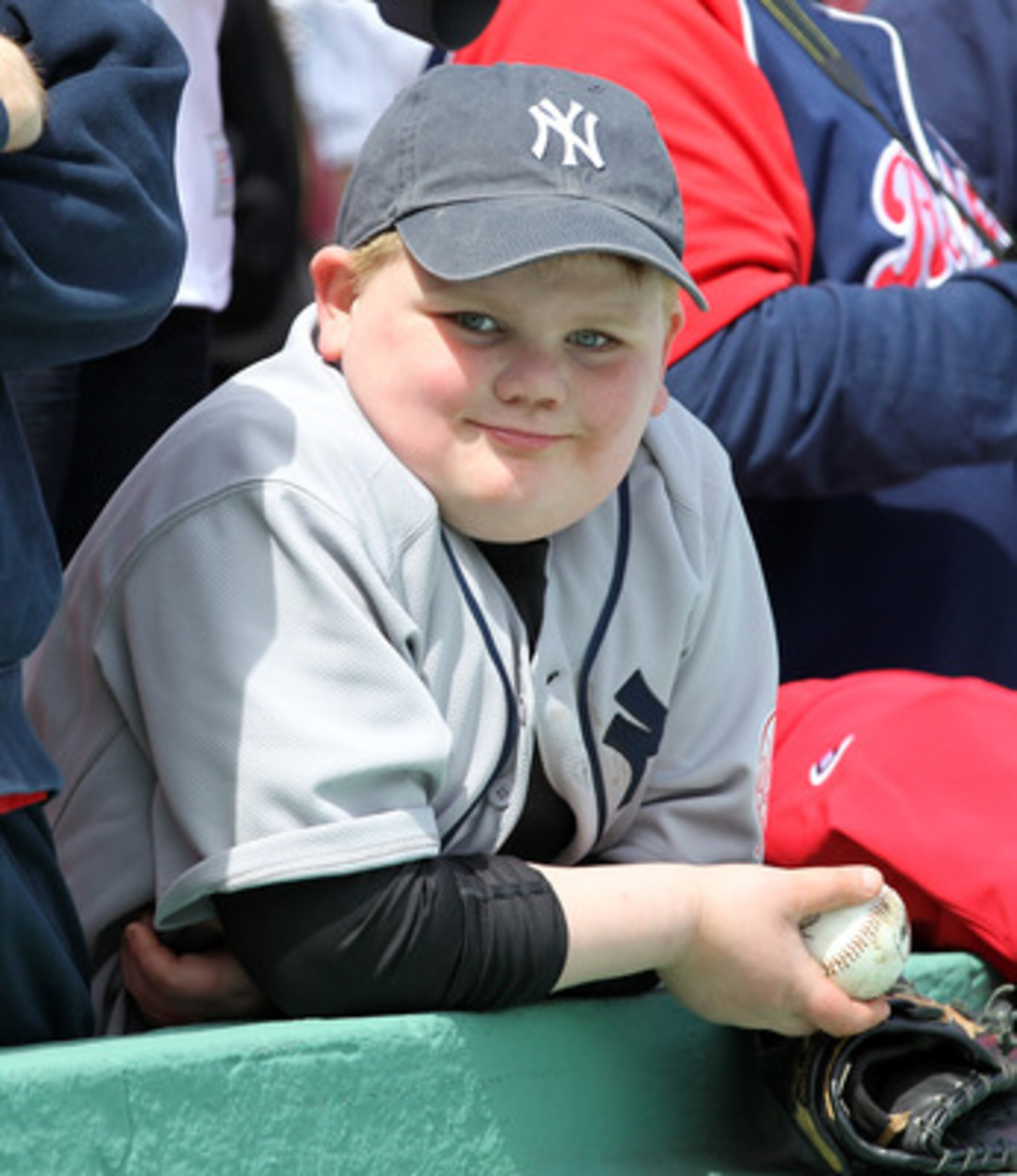 BOSTON, MA - APRIL 8:  A New York Yankees fan uis senn on Opening Day before the game between the New York Yankees and Boston Red Sox at Fenway Park on April 8, 2011 in Boston, Massachusetts. (Photo by Jim Rogash/Getty Images)