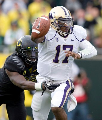 EUGENE, OR - NOVEMBER 6: Quarterback Keith Price #17 of the Washington Huskies is pressured by linebacker Josh Kaddu #56 of the Oregon Ducks in the third quarter of the game at Autzen Stadium on November 6, 2010 in Eugene, Oregon. The Ducks won the game 5